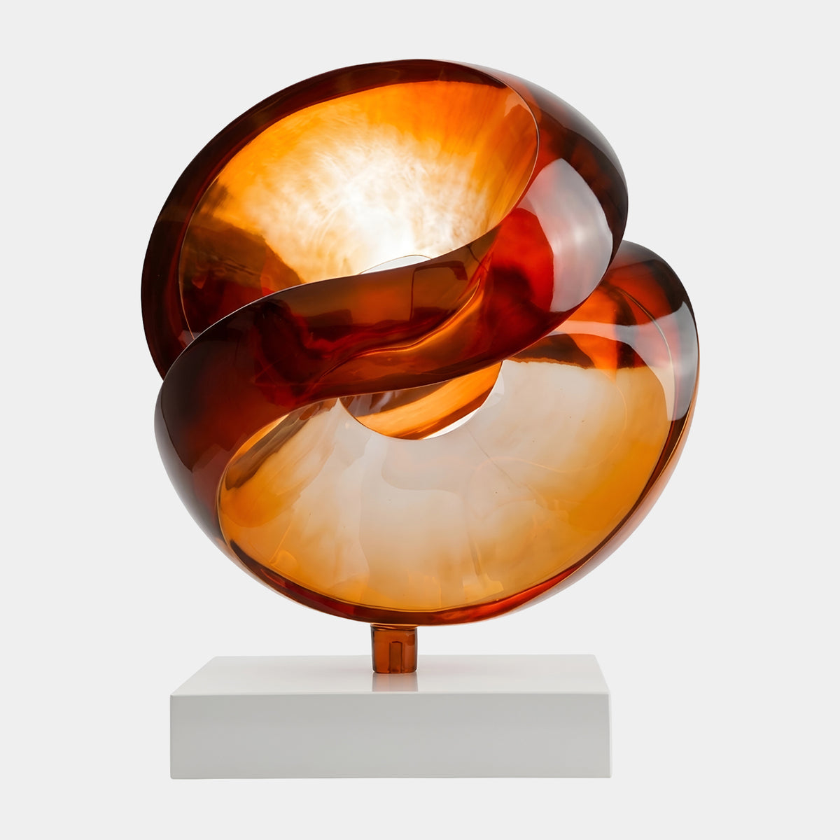 Amber Double Scoop Cut Sphere on Marble Resin Sculpture - 74cm, swirling amber-to-red glass form on a white marble base, set against a plain light background.