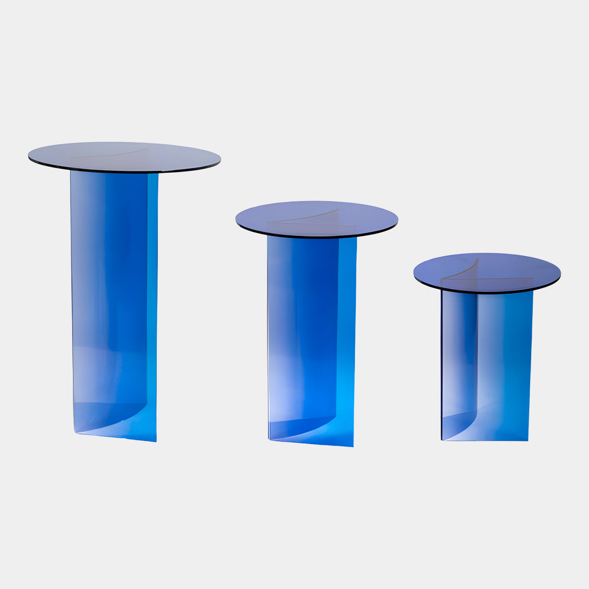 Blue Graded Rolled Foot Acrylic Side Tables Set of Three, 110cm, with round glass tops on curled acrylic panel bases, shown on a plain white background.