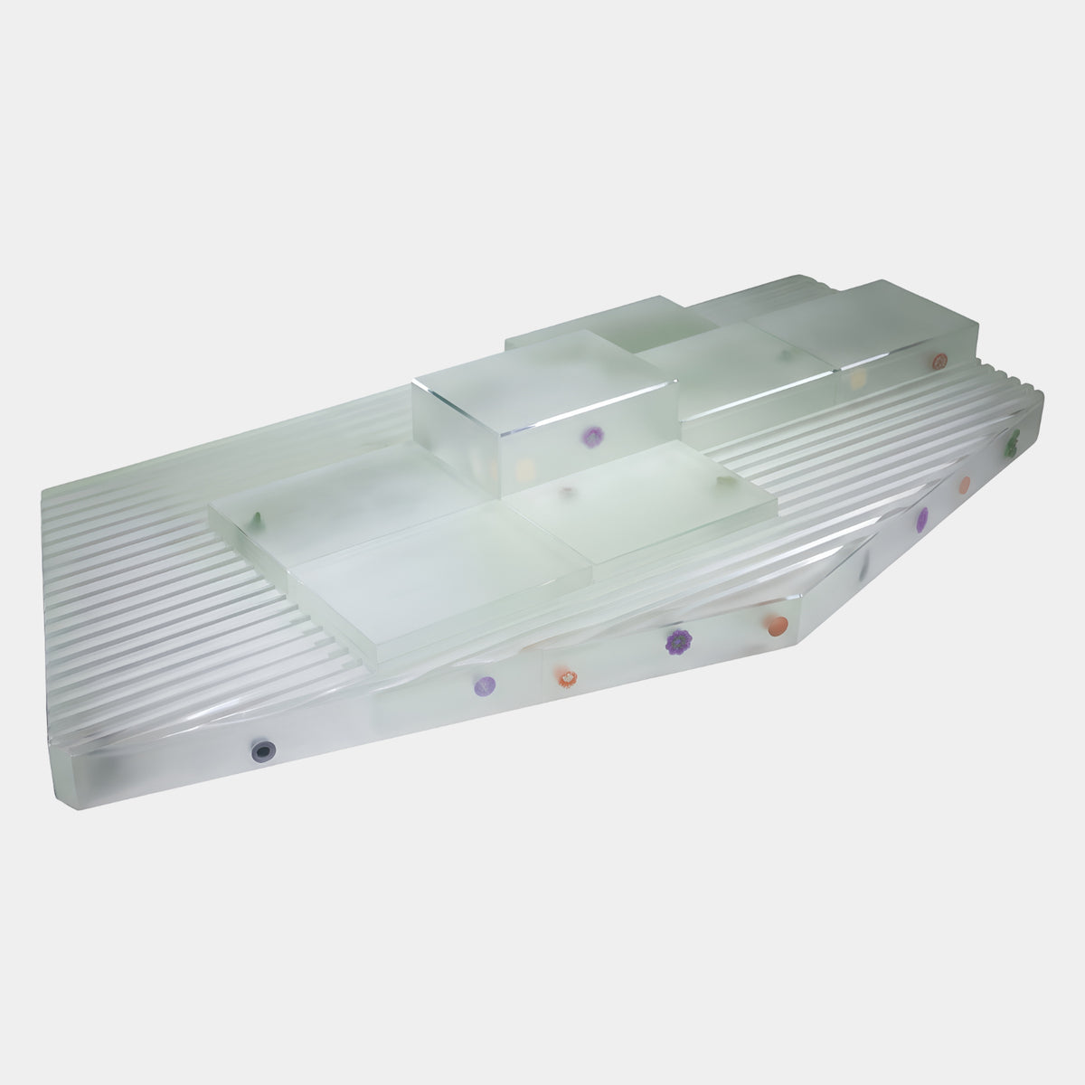 Frosted Fluted & Stepped Resin Abstract Sculpture (233cm) by Giant Sculptures, a long frosted resin slab with fluted grooves, stepped blocks, and purple and orange inclusions, on a plain white background.