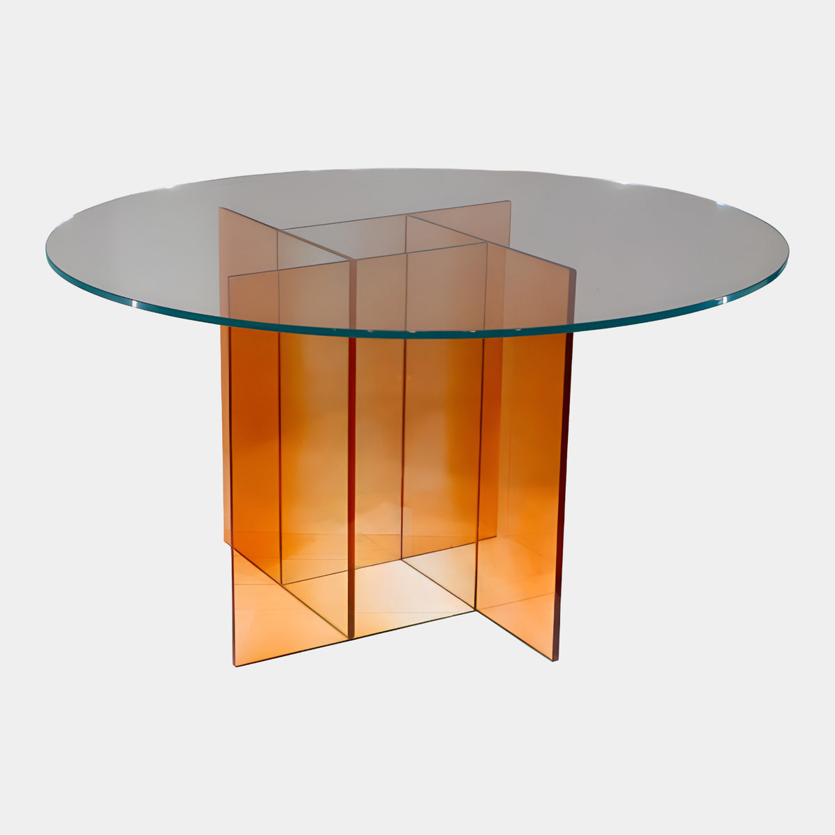 Clear Glass Coffee Table on Orange Crossed Panels - 100cm, round glass top over an interlocked orange acrylic panel base, shown on a plain white background.