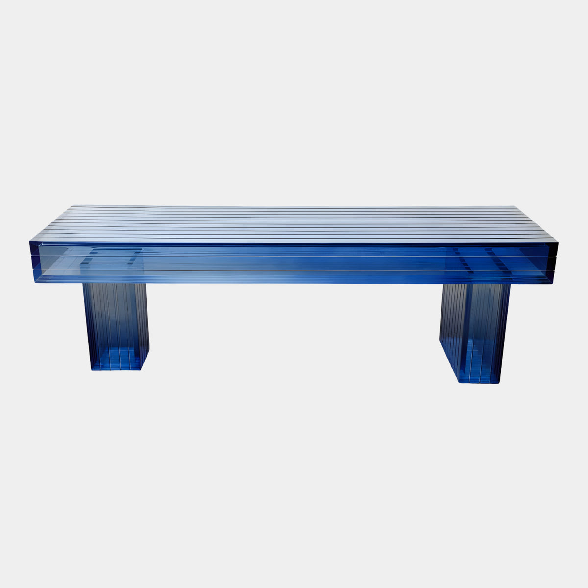 Blue Graded Ribbed Slab Acrylic Bench (140cm) by Giant Sculptures, showing a ribbed acrylic seat on two ribbed block legs against a plain white background.