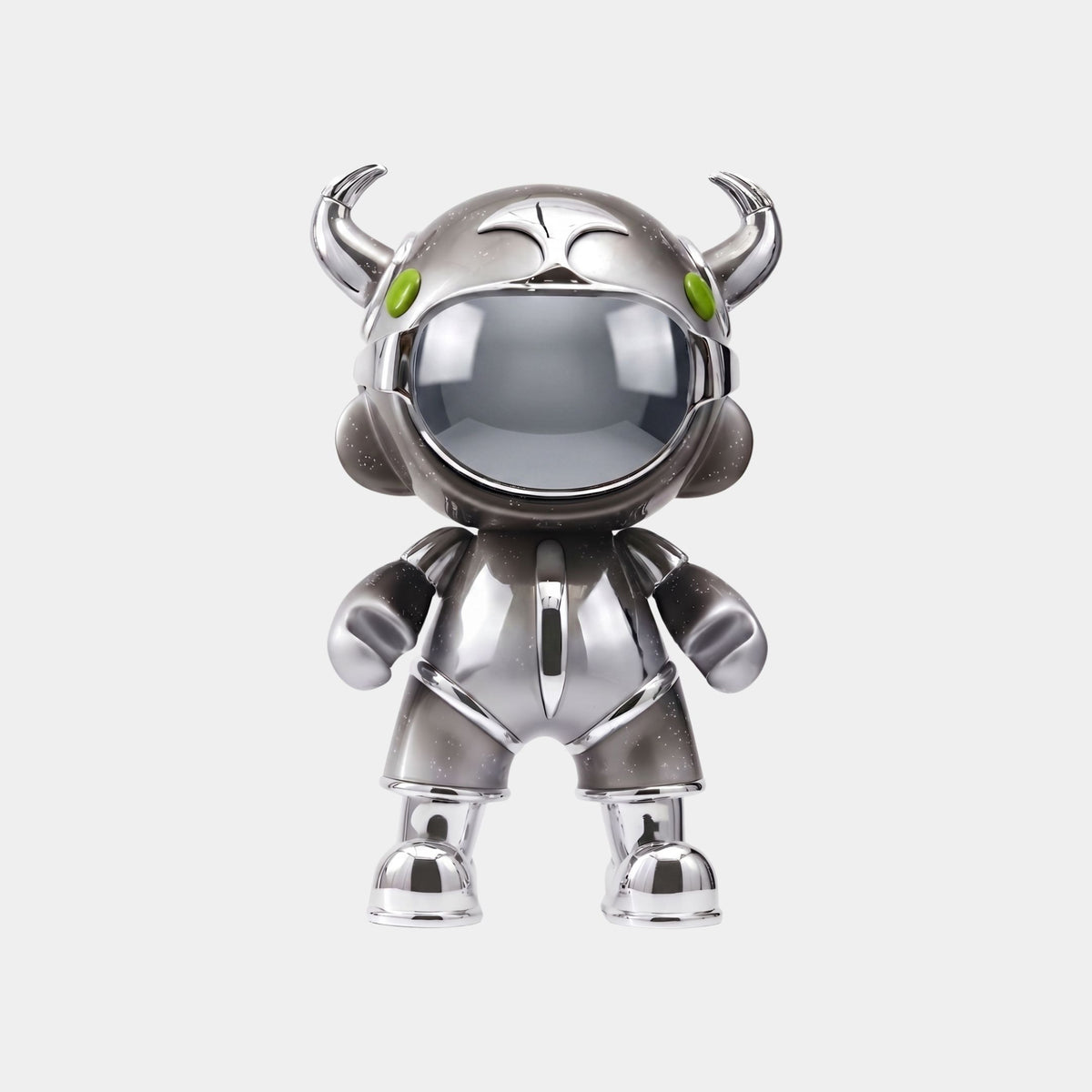 The Giant Sculptures Dark Chrome Suit Astro Devil Figure - 48cm stands upright on a white background, featuring a shiny silver finish, green eyes, two small horns, large round hands, and a reflective dark chrome suit for a bold look.