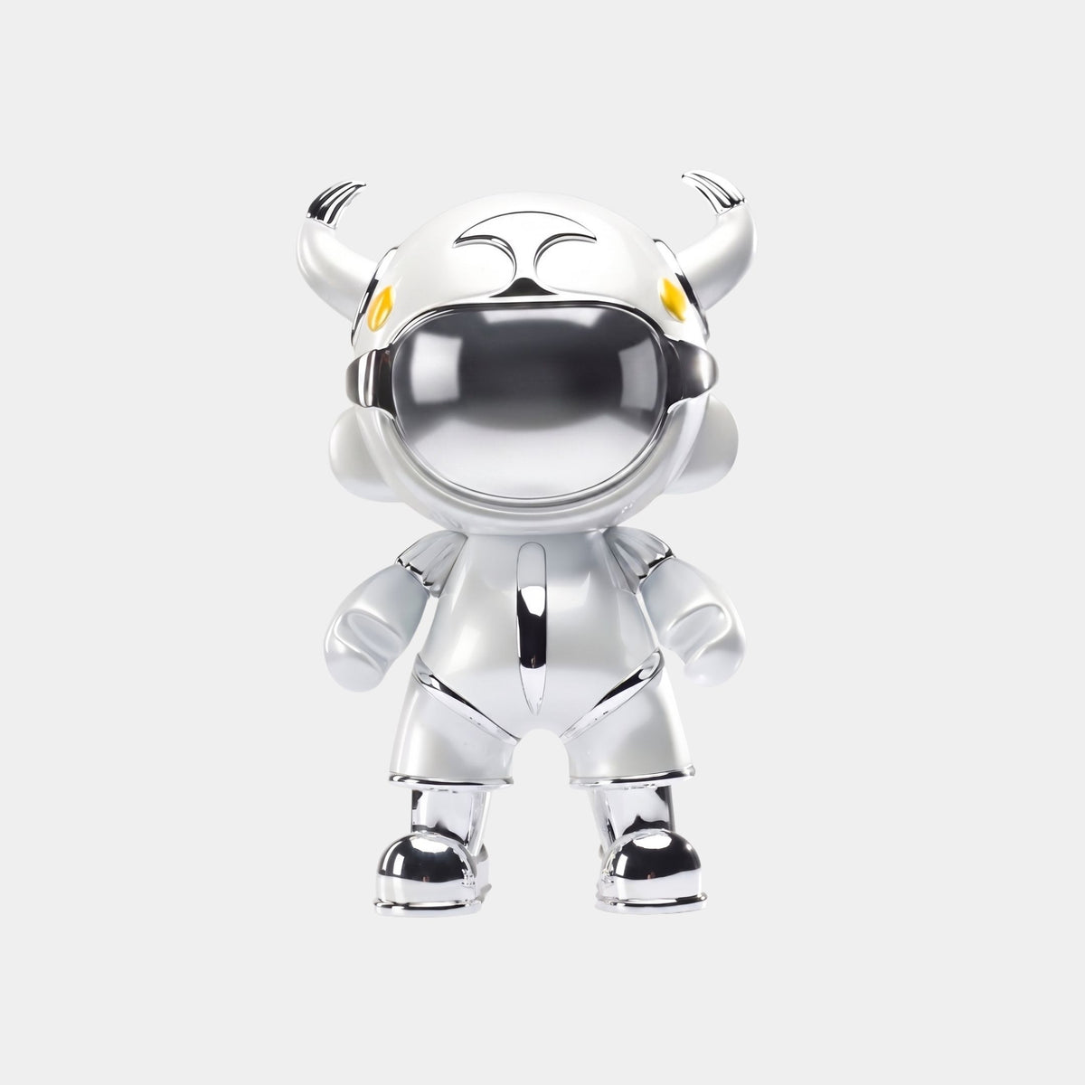 The Giant Sculptures Silver Suit Astro Devil Figure (48cm) features a horned helmet, yellow eyes, and a reflective visor—ideal as futuristic astronaut decor against a white background.