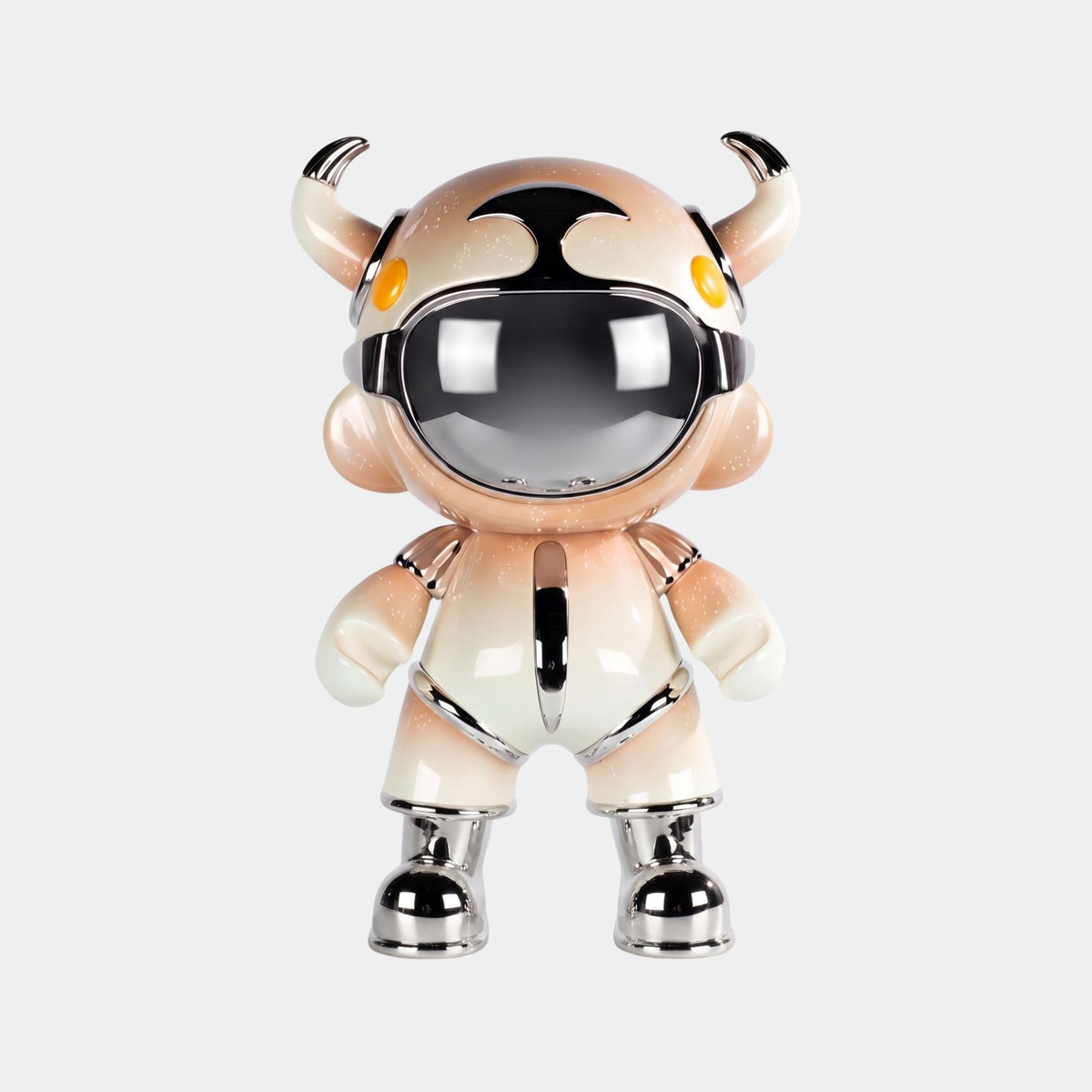 The Champagne Suit Astro Devil Sculpture by Giant Sculptures stands upright, featuring a cartoon-like character with a metallic helmet, mirrored chrome visor, two horns, yellow eyes, and a reflective champagne suit against a plain white background.