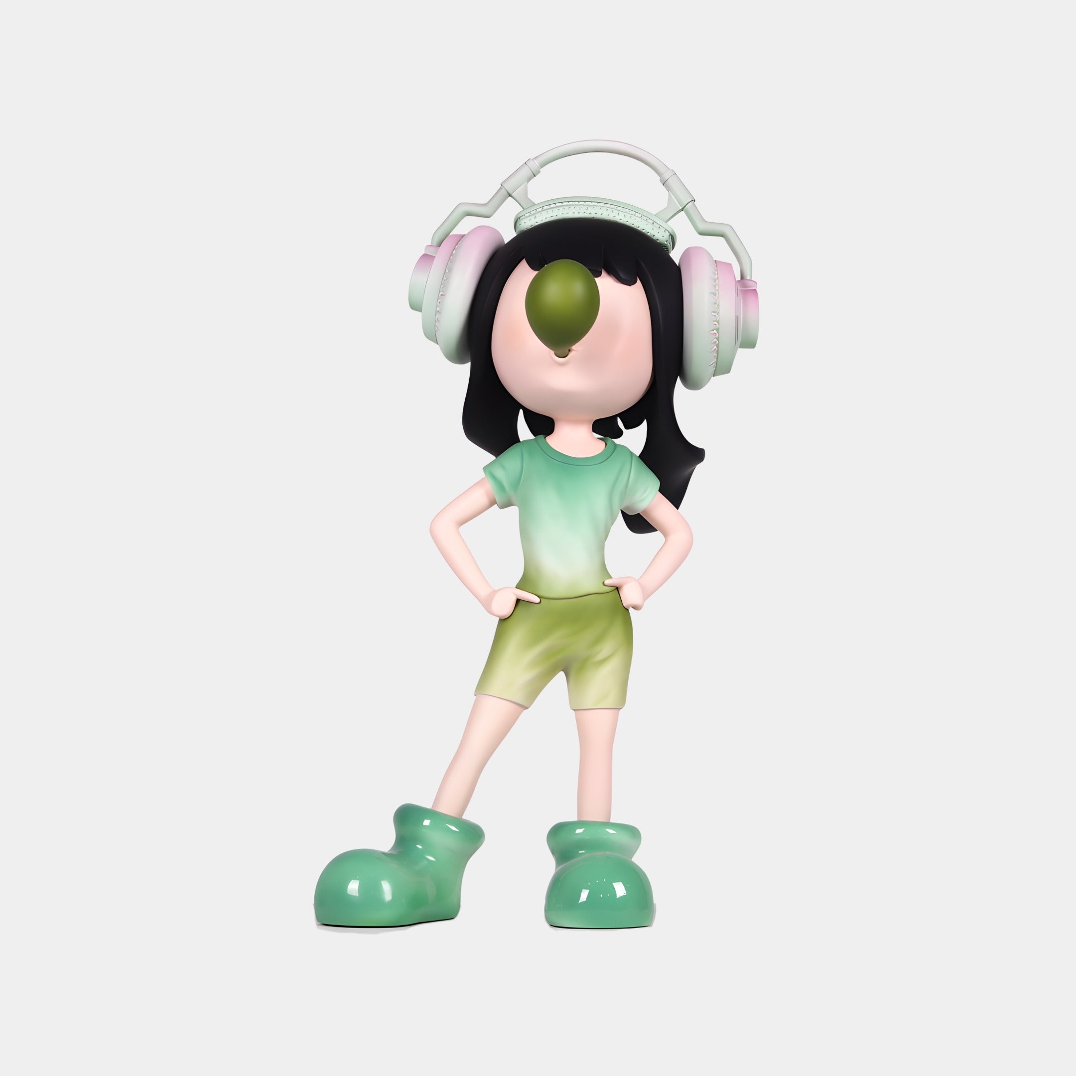 The Giant Sculptures Urban Sage Vibella Headphone Figure (60cm) features long dark hair, large headphones, a green and white shirt, green shorts, matching oversized shoes, and an olive covering its face while standing confidently hands on hips.