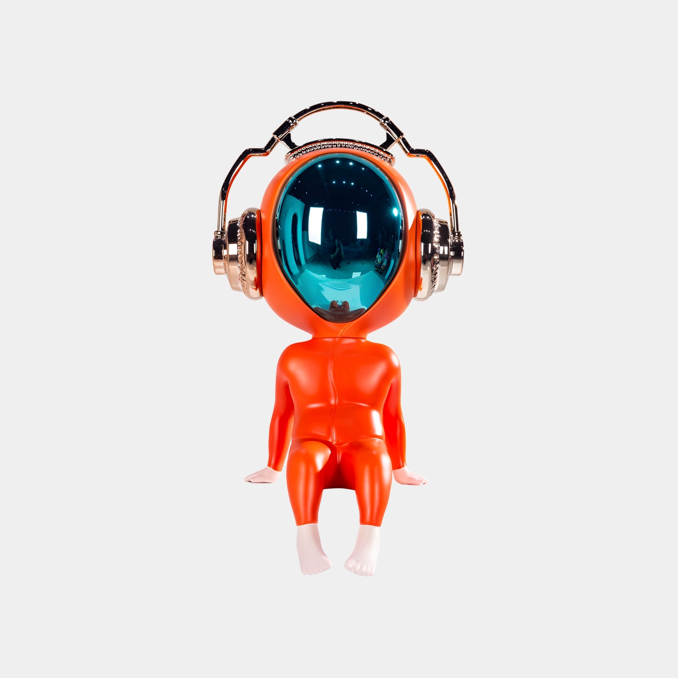The Neon Orange Alien Beats Figure - 55cm by Giant Sculptures features a shiny blue helmet, metallic headphones, and white feet, making it a striking sci-fi decorative piece on any surface.
