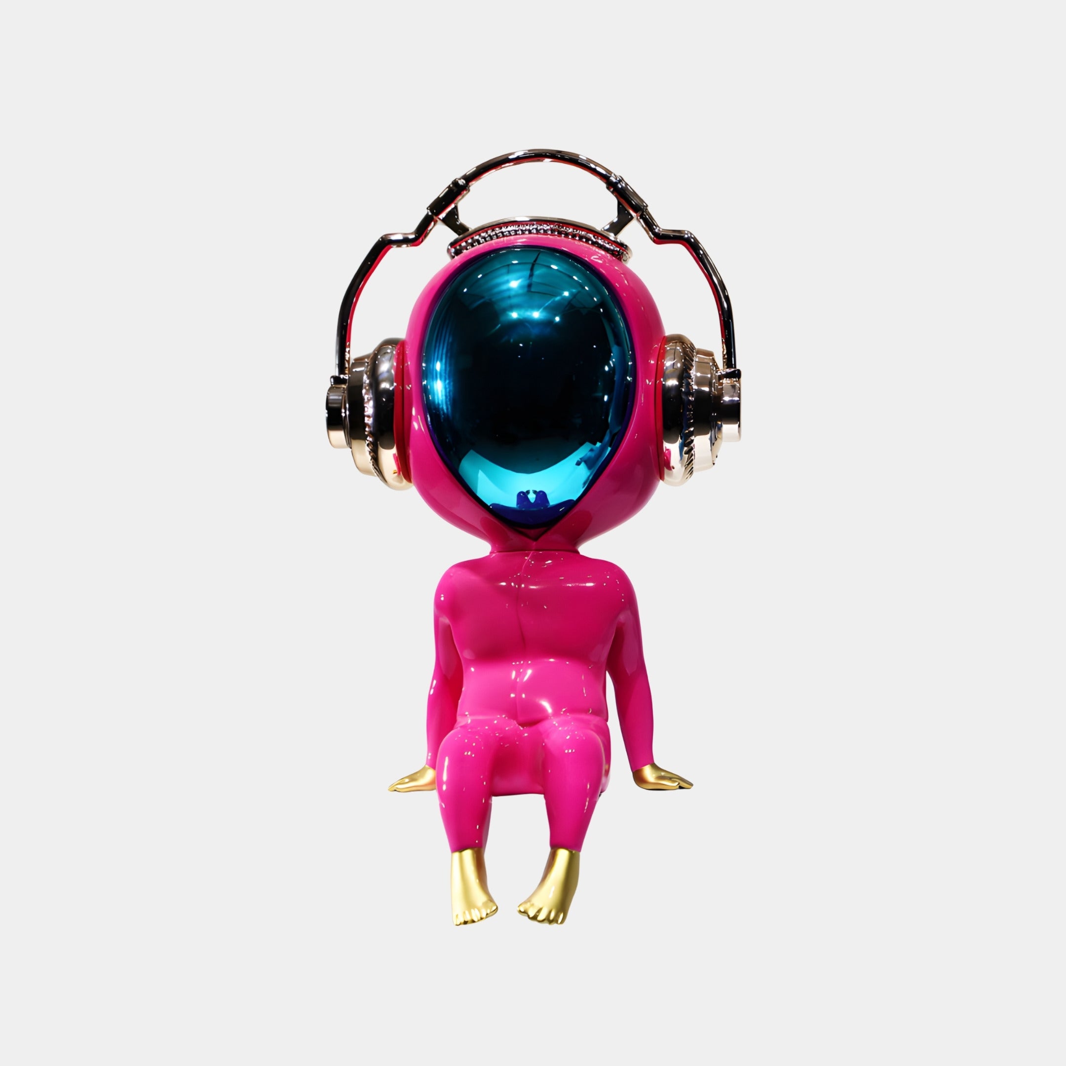 The Stellar Pink Alien Beats Figure (55cm) by Giant Sculptures features a shiny pink alien with a large blue reflective helmet, metallic headphones, and gold hands and feet—an eye-catching pop art decor piece against a white background.