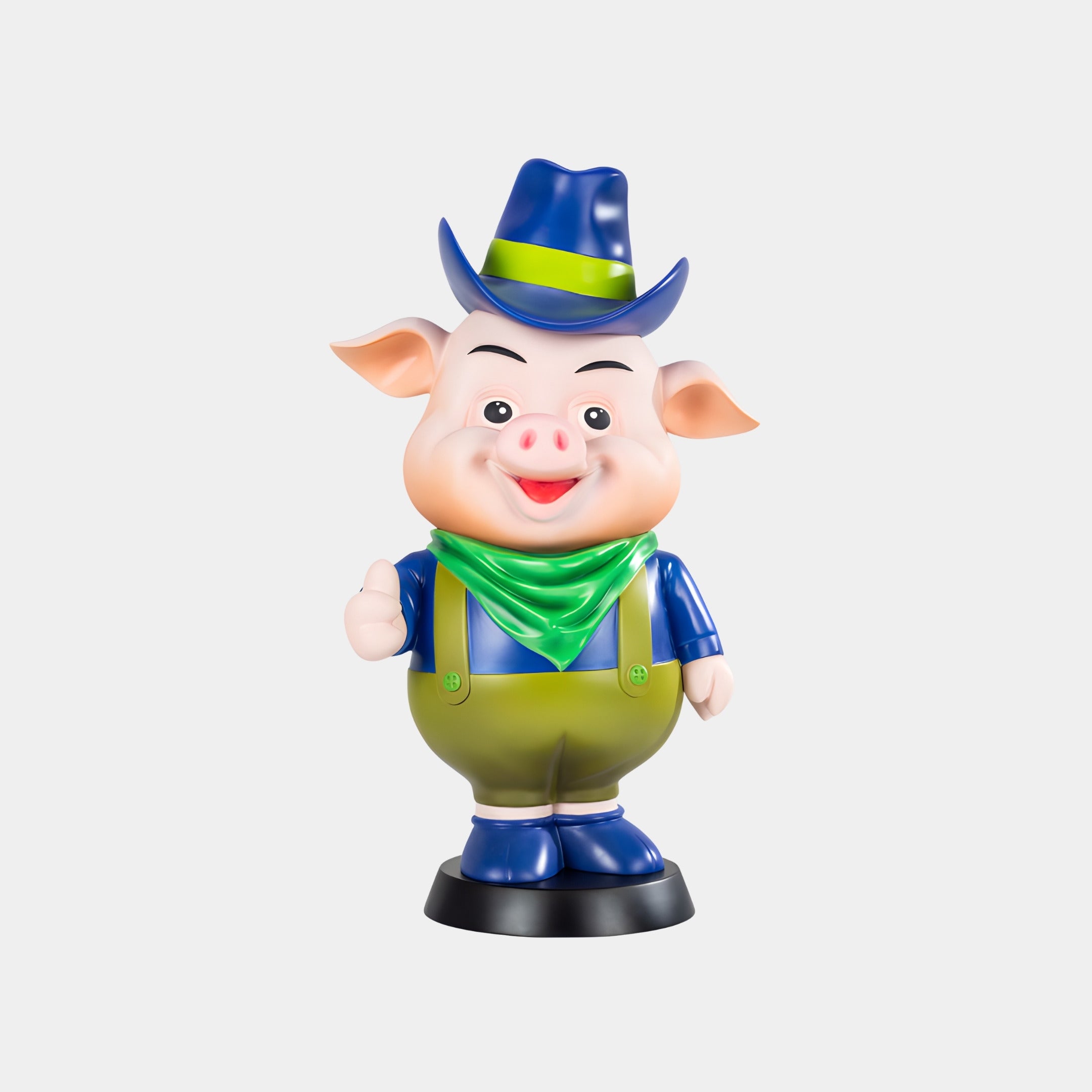 The Blue Hat Snortle Sculpture - 69cm by Giant Sculptures features a cartoon-style pig in green overalls and blue hat, giving a thumbs up—an ideal playful accent for contemporary interiors.