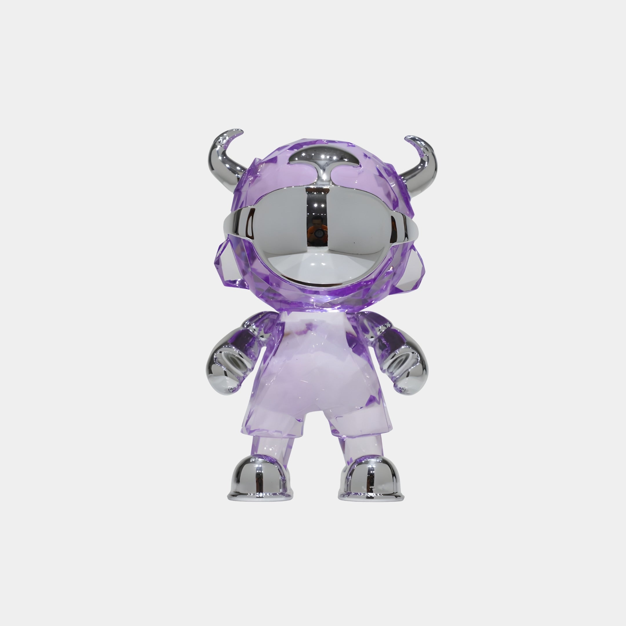 The Giant Sculptures Violet Chrome Astro Devil Figure - 15cm is a collectible designer toy with a shiny chrome face, hands, and feet, clear purple suit, and horned helmet, shown standing upright against a white background.