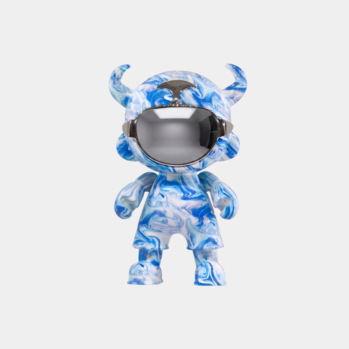 The Ocean Camo Astro Devil Figure - 35cm by Giant Sculptures features a blue and white marbled design, horn-like head shapes, and a shiny visor helmet covering its eyes, displayed on a plain white background.