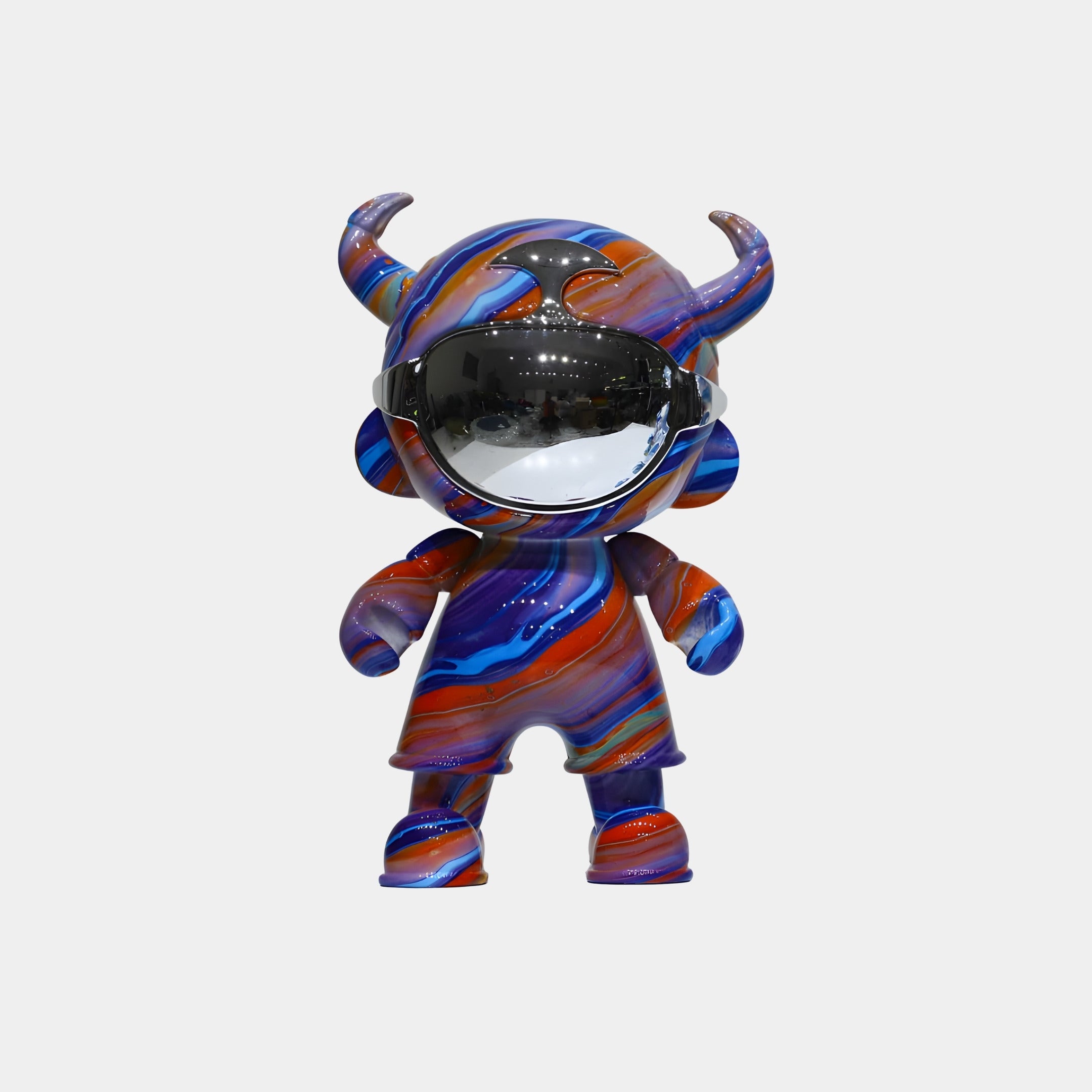 The Midnight Flow Astro Devil Figure by Giant Sculptures stands 35cm tall, featuring horn-like details, a shiny silver visor, and swirling blue, purple, and orange patterns—displayed against a plain white background.
