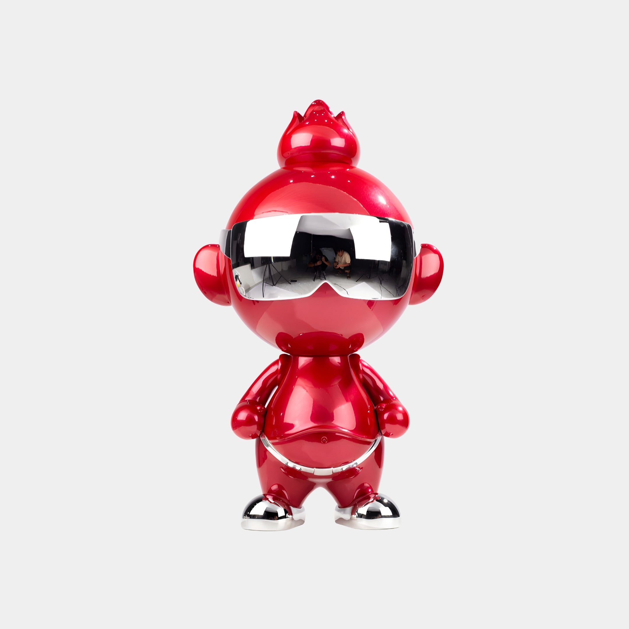 The Ruby Chrome Orbix Figure - 48cm by Giant Sculptures features a shiny red finish, large round ears, silver sunglasses, and metallic accents on its feet and belt, standing upright against a plain white background.