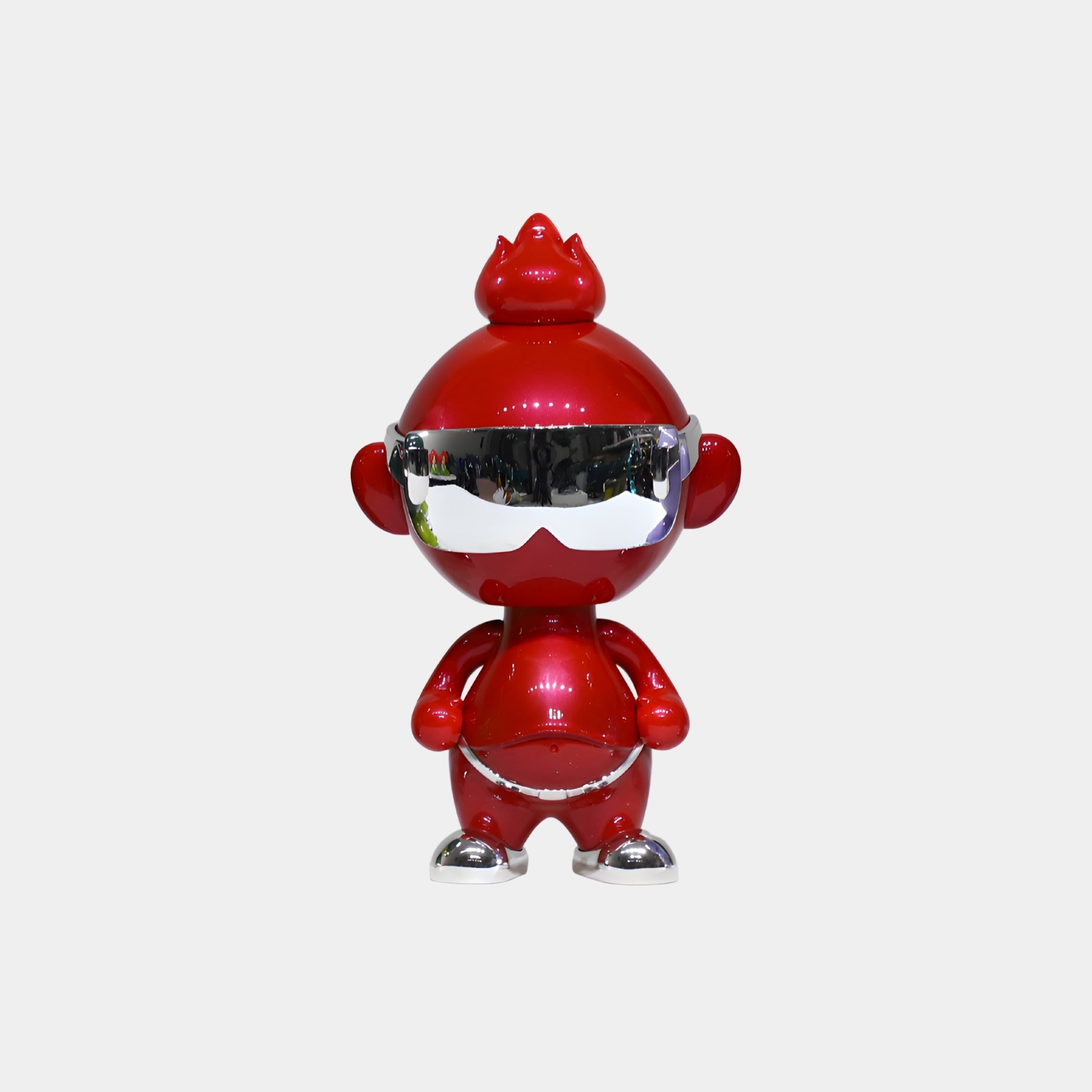 The Crimson Chrome Orbix Figure - 29cm by Giant Sculptures showcases a shiny red body, round head, pointy crown, chrome visor, and small limbs—a bold piece of modern character design on a plain white background.
