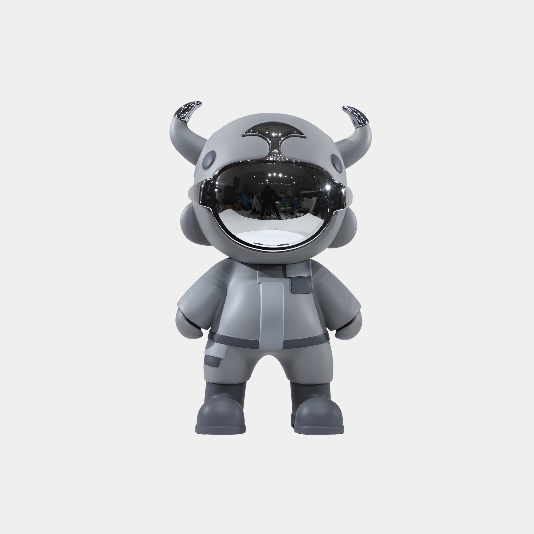 The Stealth Grey Astro Devil Figure - 35cm by Giant Sculptures is a gray collectible with a shiny helmet, small horns, and matching suit and boots, standing upright on a plain white background.