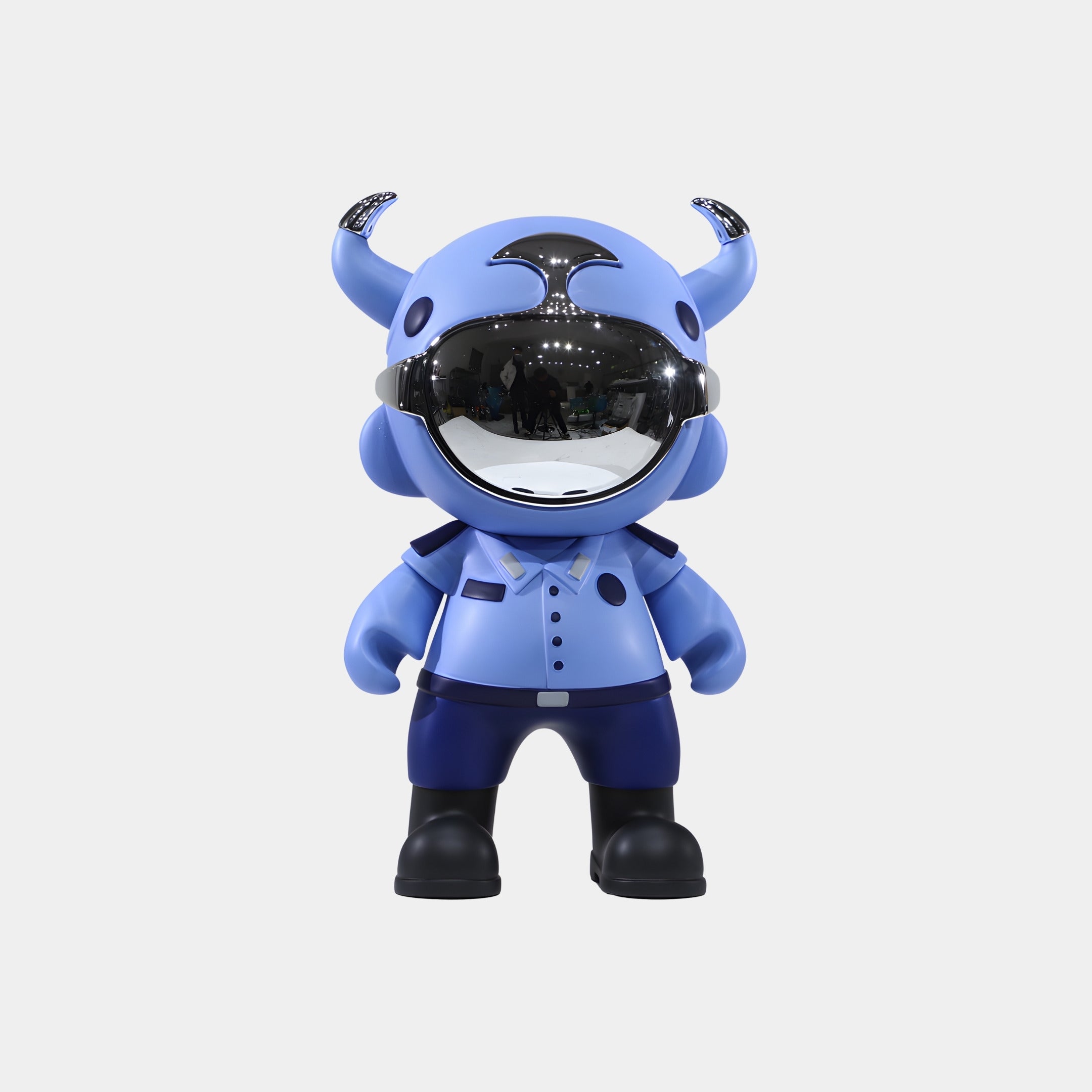 The Giant Sculptures Sky Blue Patrol Astro Devil Figure - 35cm showcases a blue horned cartoon character with a reflective visor helmet and collared shirt, standing forward against a plain white background.