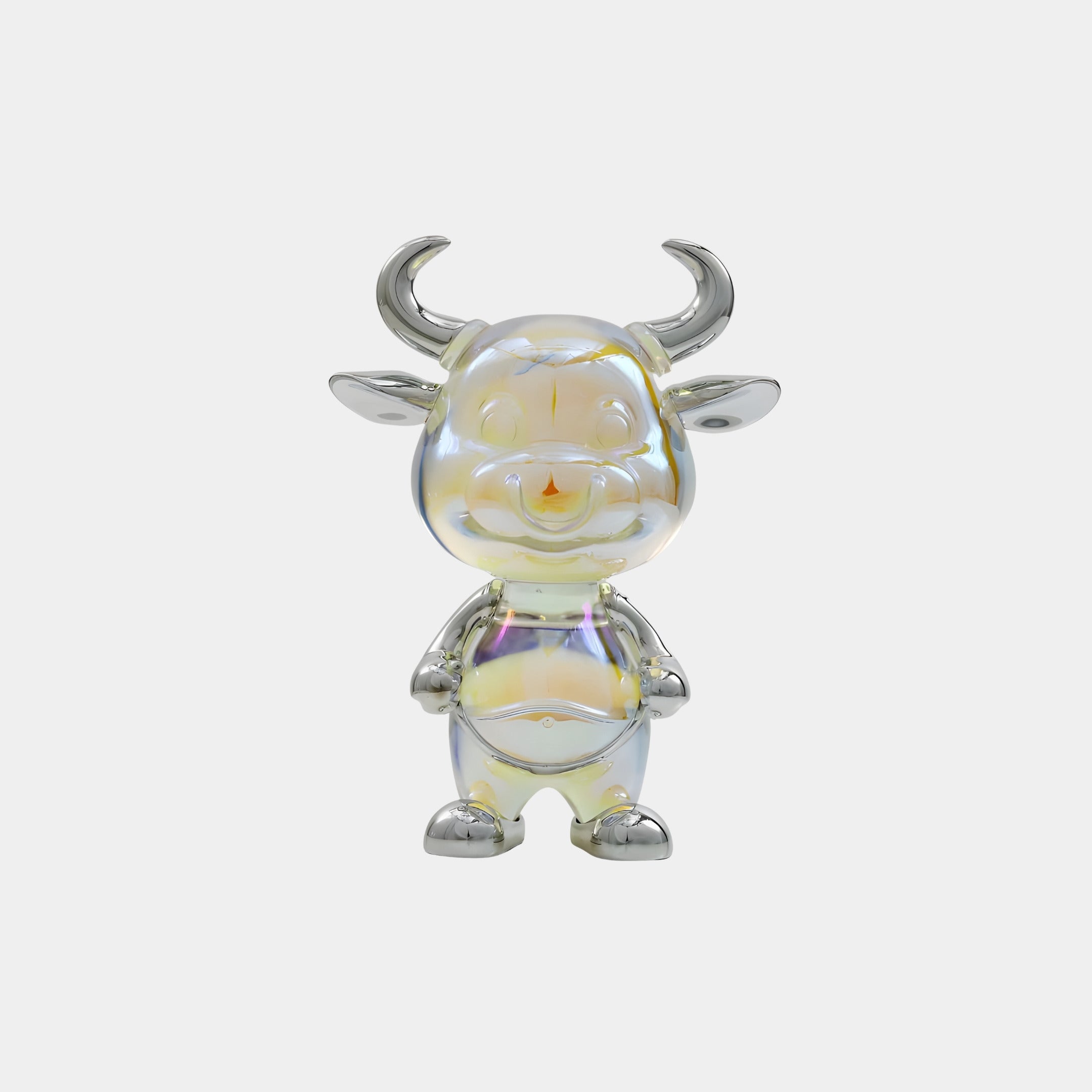 The Nova Bull Iridescent Glintz Figure by Giant Sculptures stands 17cm tall, displaying pearly hues with silver horns, ears, feet, and hands. Crafted from 3D-printed resin, this cheerful collectible pops against a plain white background.