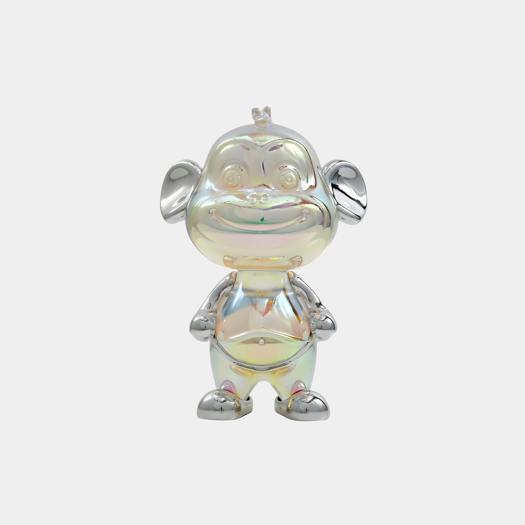 The Giant Sculptures Solin Monkey Iridescent Glintz Figure - 16cm stands upright with big round ears, a small crown, and hands on its belly, dazzling with rainbow reflections against a plain white background.