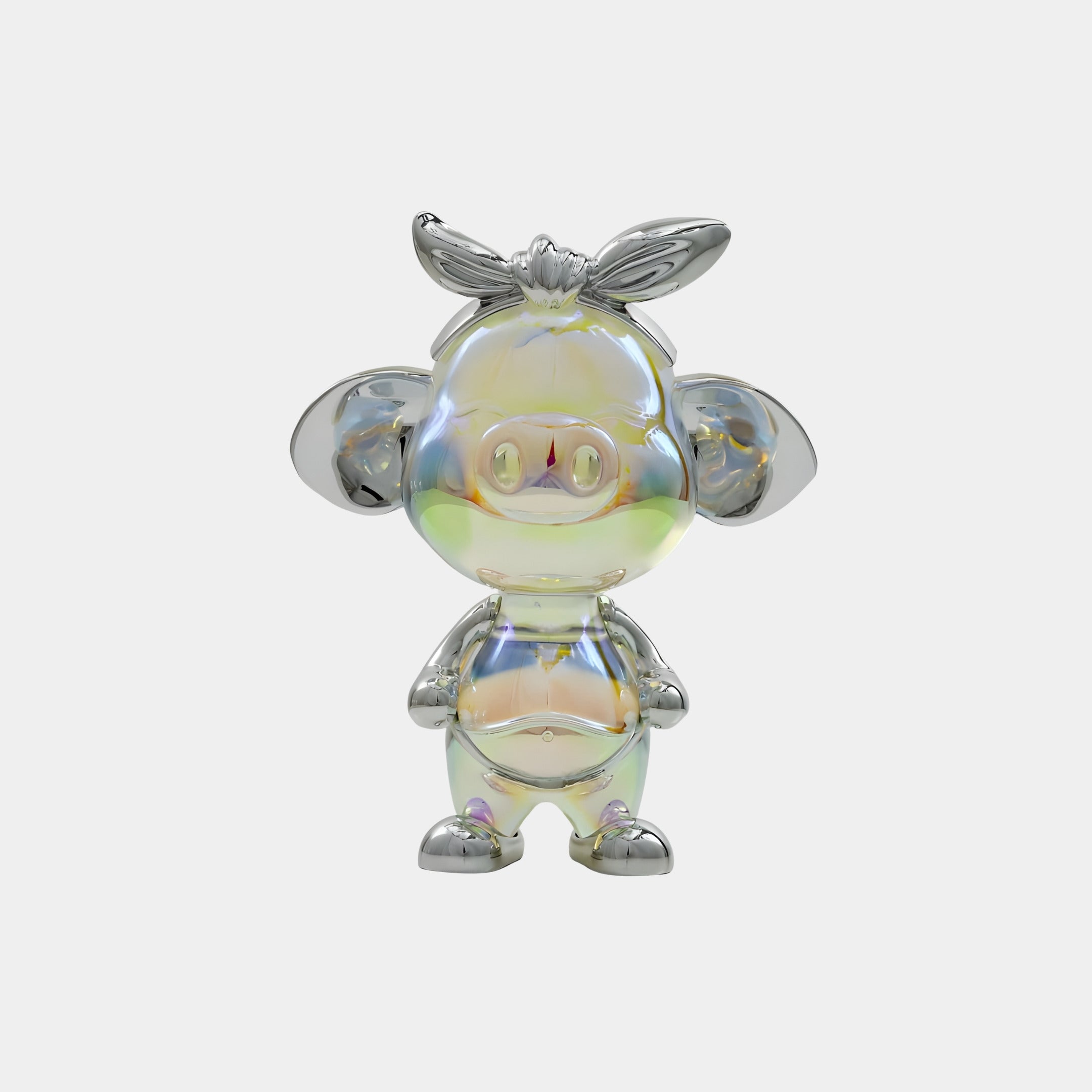 The Miro Pig Iridescent Glintz Figure by Giant Sculptures is a 17cm shiny, iridescent resin collectible with large round ears, a small snout, and a bow on its head, standing upright against a plain white background.