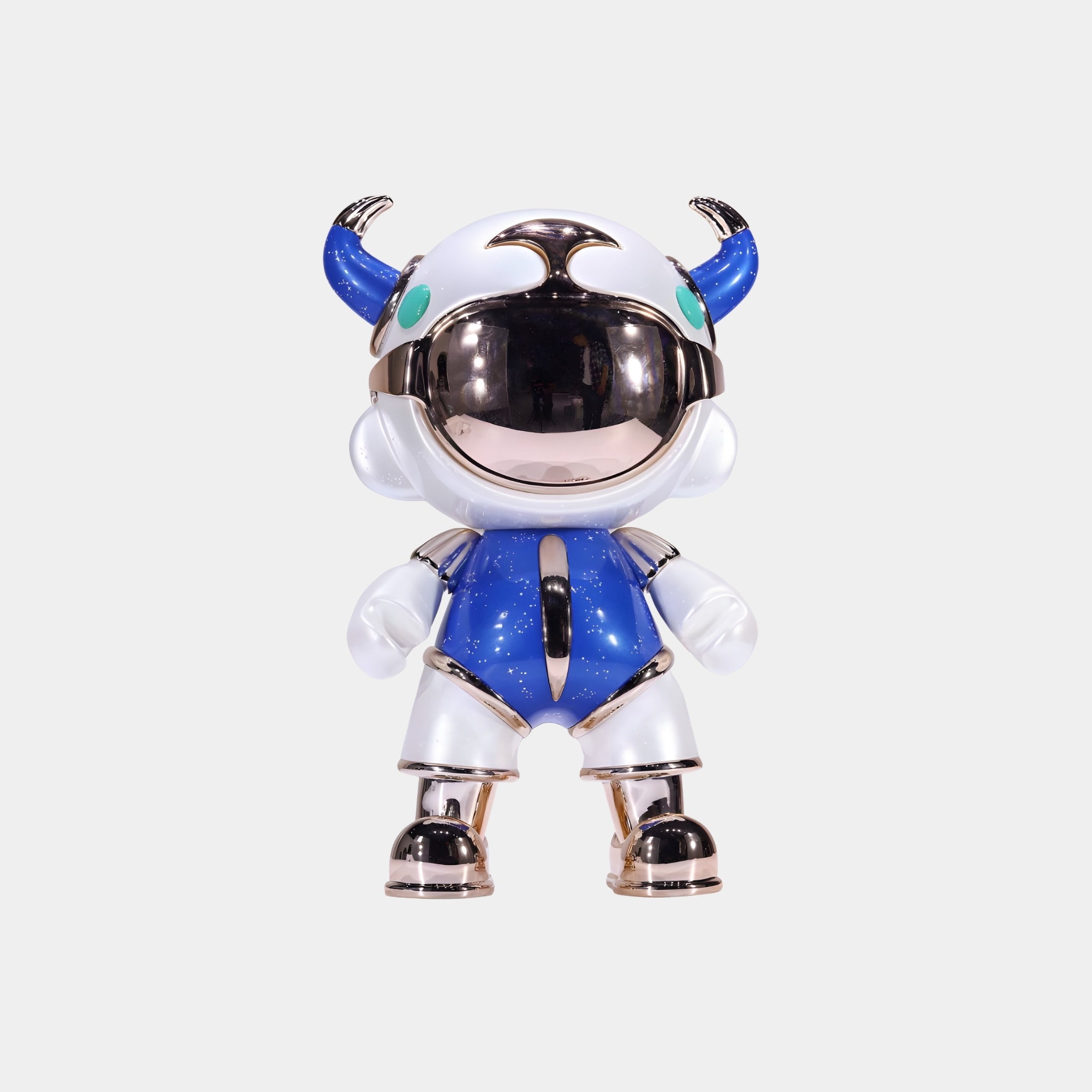 The Blue & White Suit Astro Devil Figure - 31cm by Giant Sculptures features a metallic helmet with a visor and green accents, horn-like ears, and a blue and white suit, standing upright against a plain white background.