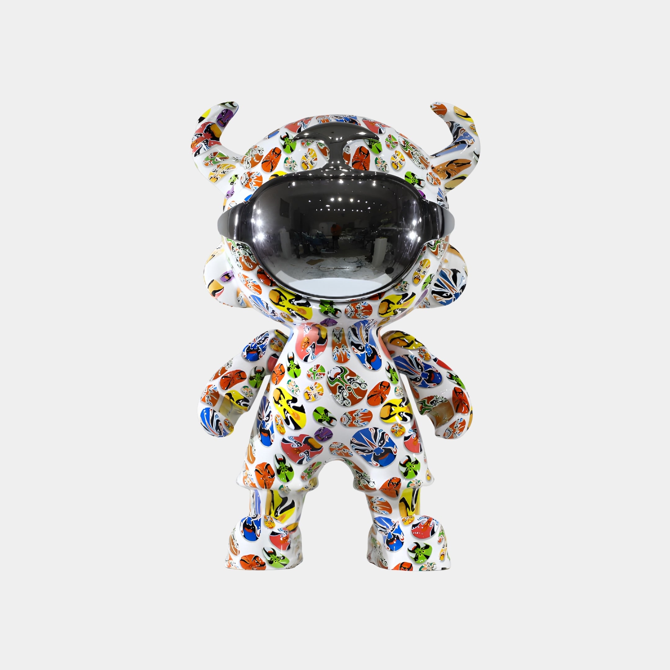 The Doodle Pop Astro Devil Sculpture (80cm) by Giant Sculptures features a horned humanoid with a reflective visor and colorful butterfly-like patterns—an eye-catching addition to your fiberglass astronaut decor.