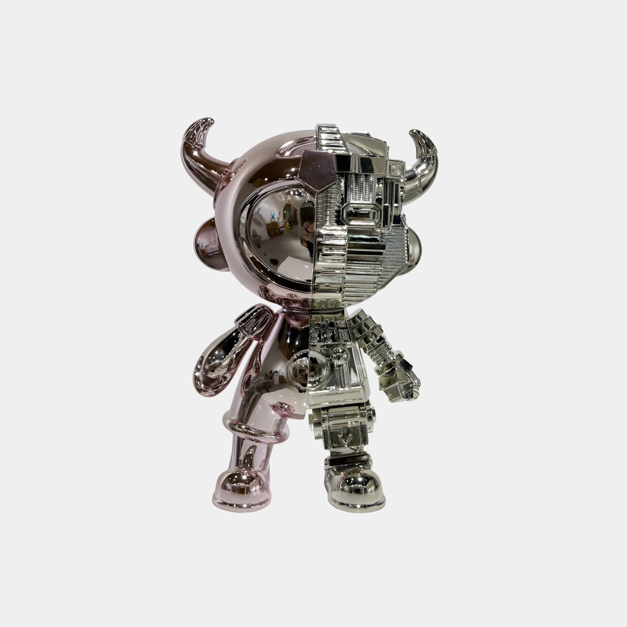 The Rose & Silver Split Astro Devil Figure by Giant Sculptures is a 35cm eco-friendly resin collectible featuring shiny horns, with one half in smooth pink metallic and the other in silver, exposing robotic mechanical details.