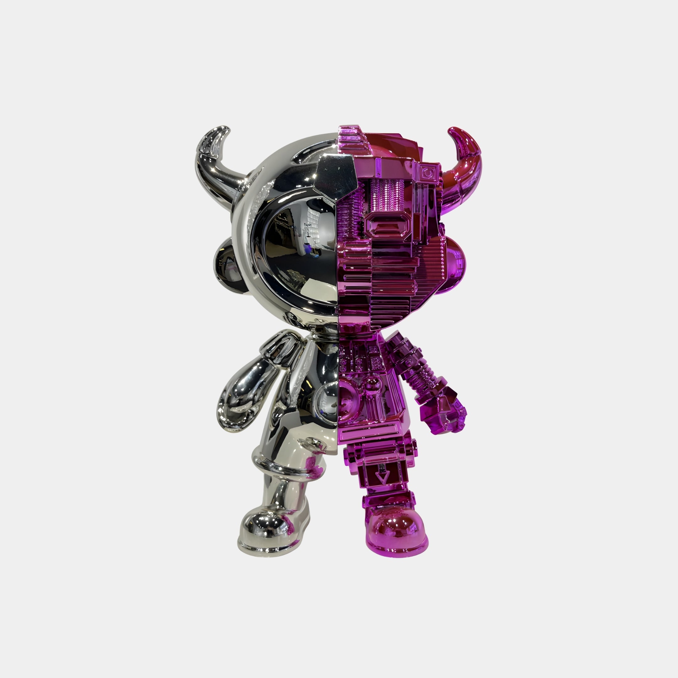 The Giant Sculptures Silver & Magenta Split Astro Devil Figure - 35cm is a collectible made of eco-friendly resin, featuring a silver left side and translucent magenta right with visible gears, displayed against a plain white background.