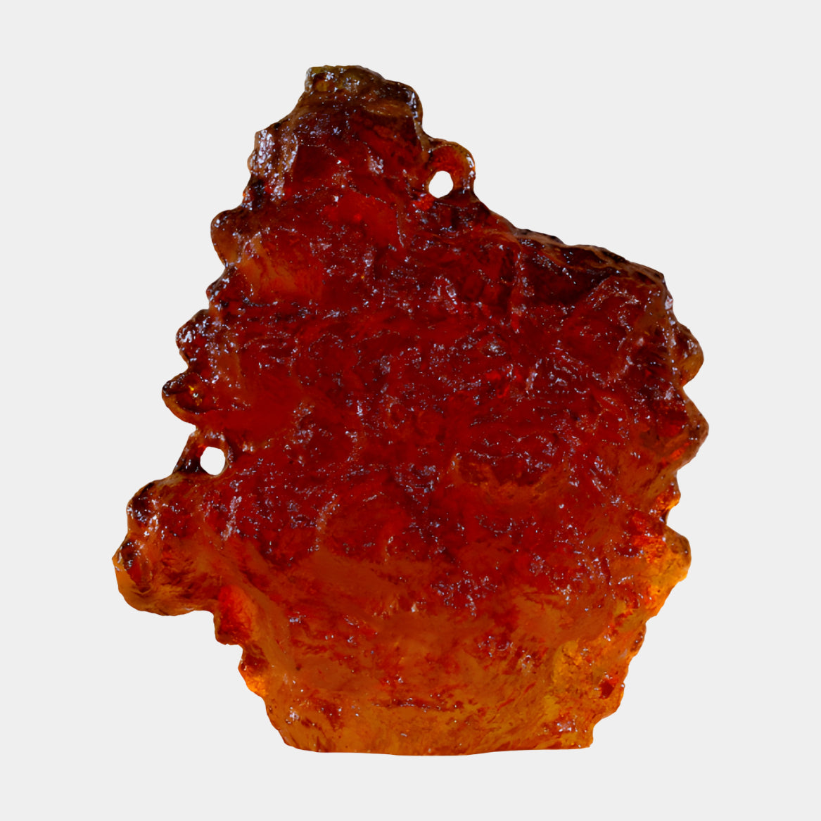 Amber & Rust Pierced Craggy Slab Resin Sculpture, 53cm, a pitted resin slab with two pierced holes, amber edges deepening to rust at center, on a plain white background.