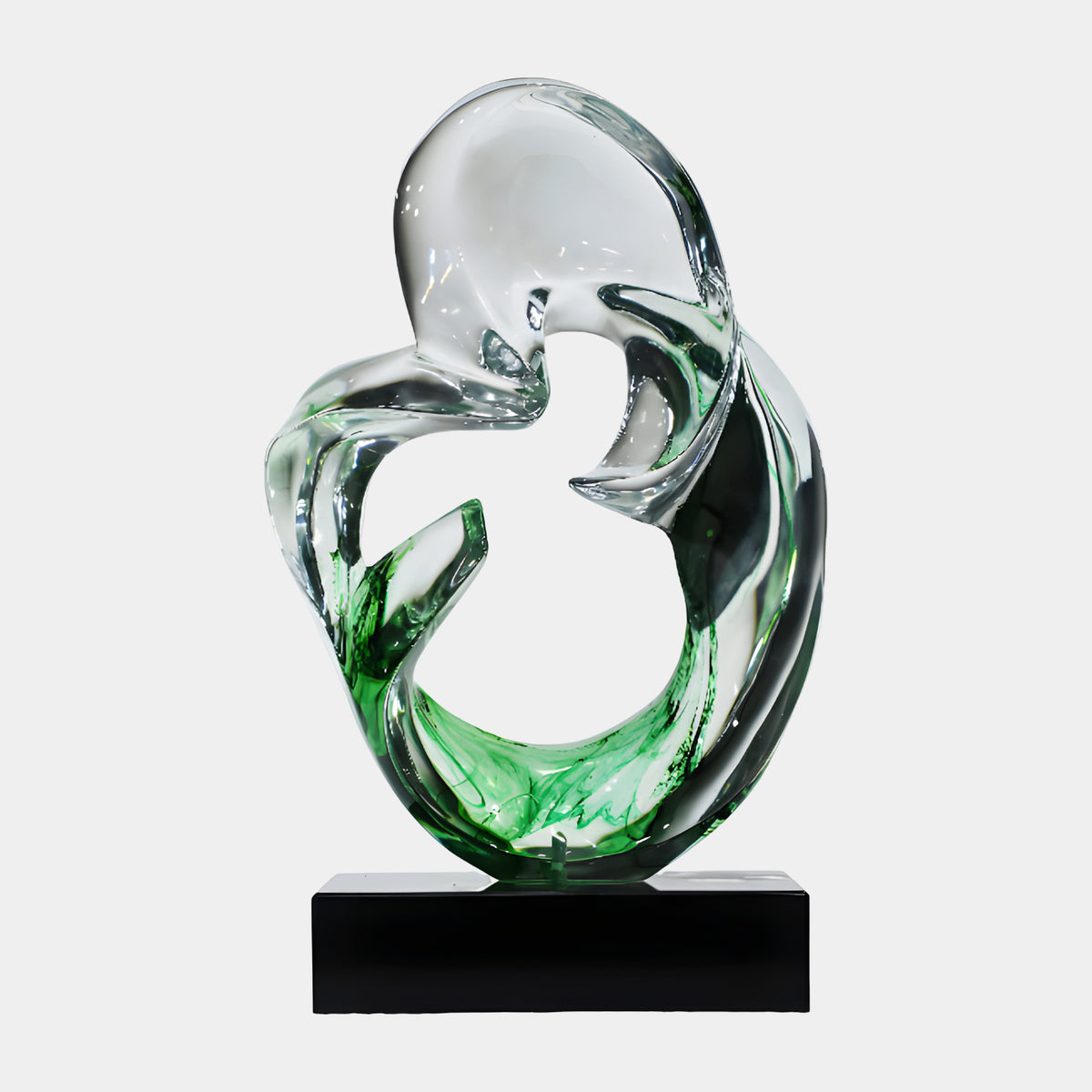 Green & Clear Closed Loop Resin Sculpture - 50cm, a swirling open-loop form with clear resin and green streaks at its base, set on a black marble stand against a plain light background.