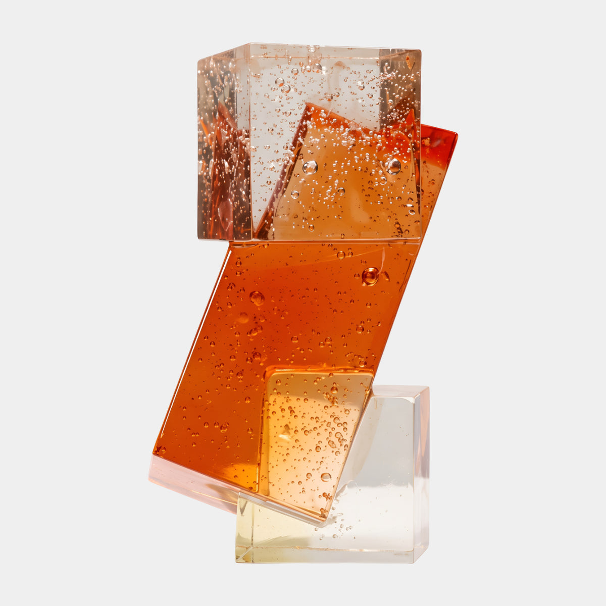 Orange Stacked Block Resin Sculpture - 35cm by Giant Sculptures, three geometric resin blocks with bubbles shifting from clear to deep orange, shown on a plain white background.