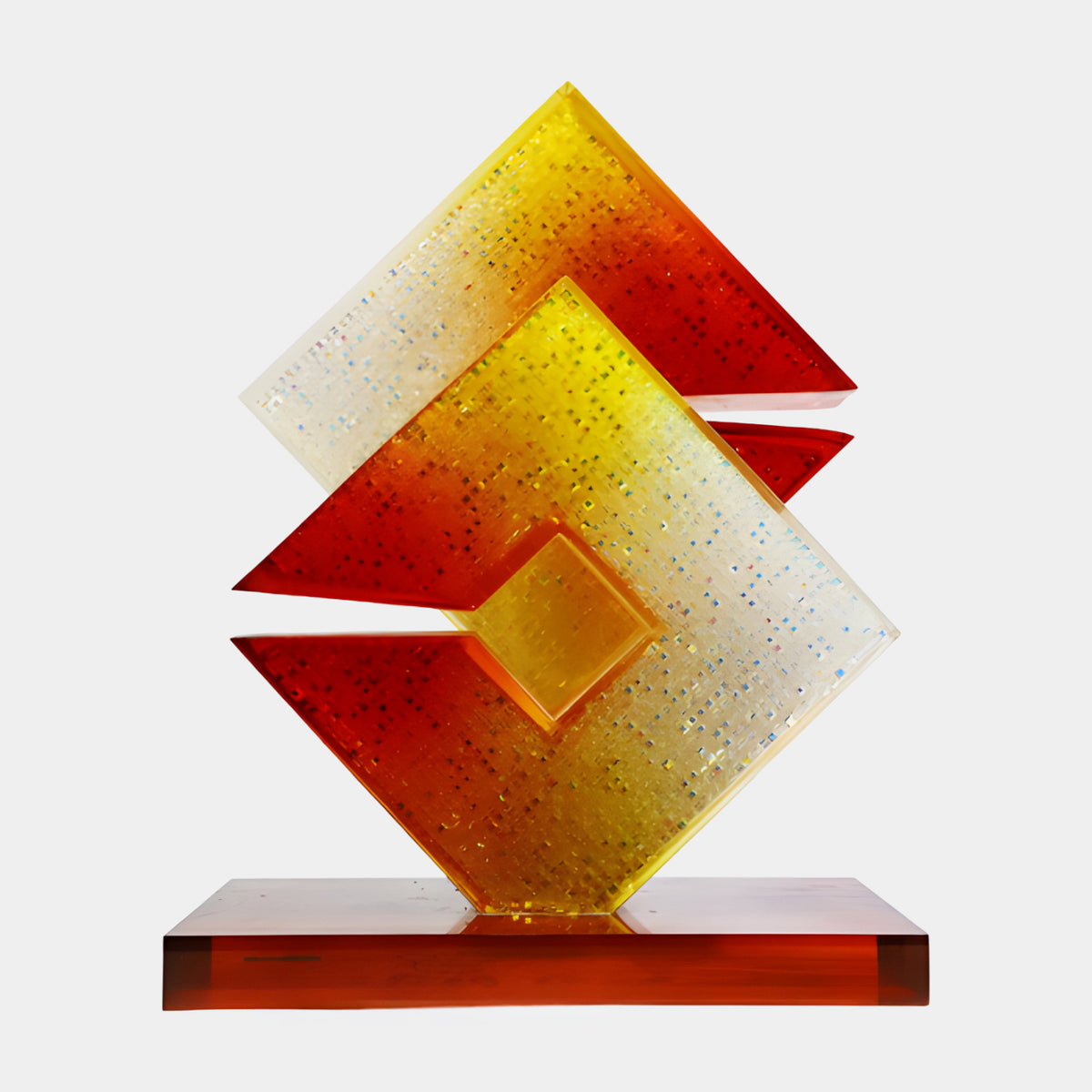 Red to Yellow Nested Chevron Glass Sculpture, 57cm, dimpled acrylic panels graduating red to yellow on an amber base, set against a plain white background.