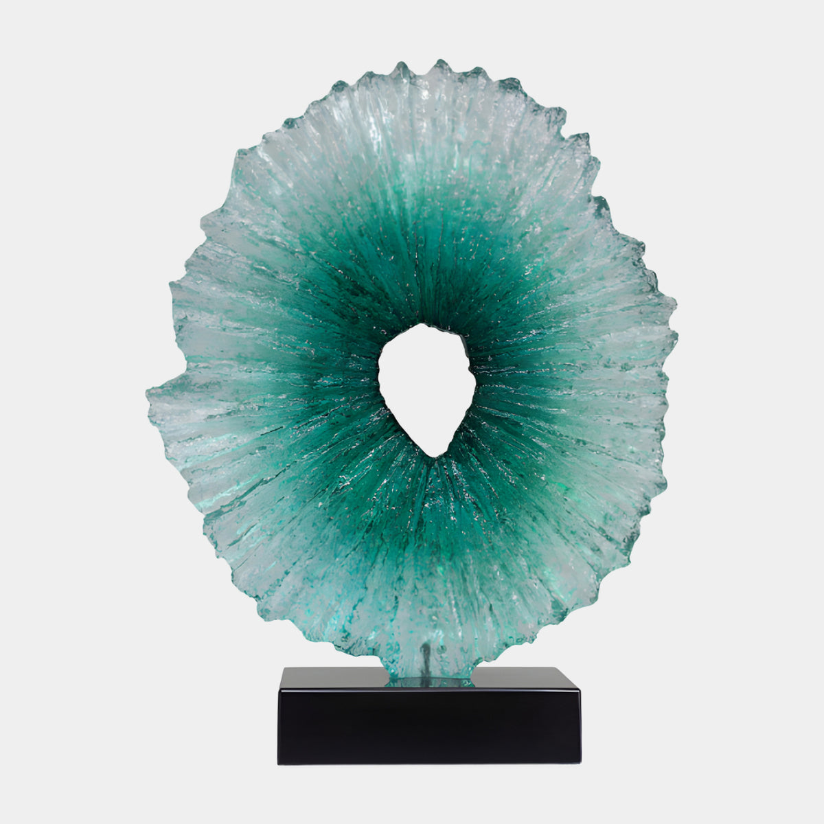 Teal to Clear Radiating Disc Resin Sculpture, 66cm, with ribs fading from sea green at the pierced center to frosted edges, set on a black base against a plain white background.