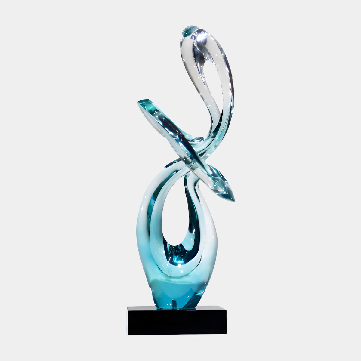 Aqua & Clear Looped Ribbon Knot Resin Sculpture, 80cm, twisting from aqua at the base to a clear glassy tip, set on a black marble block against a plain light background.