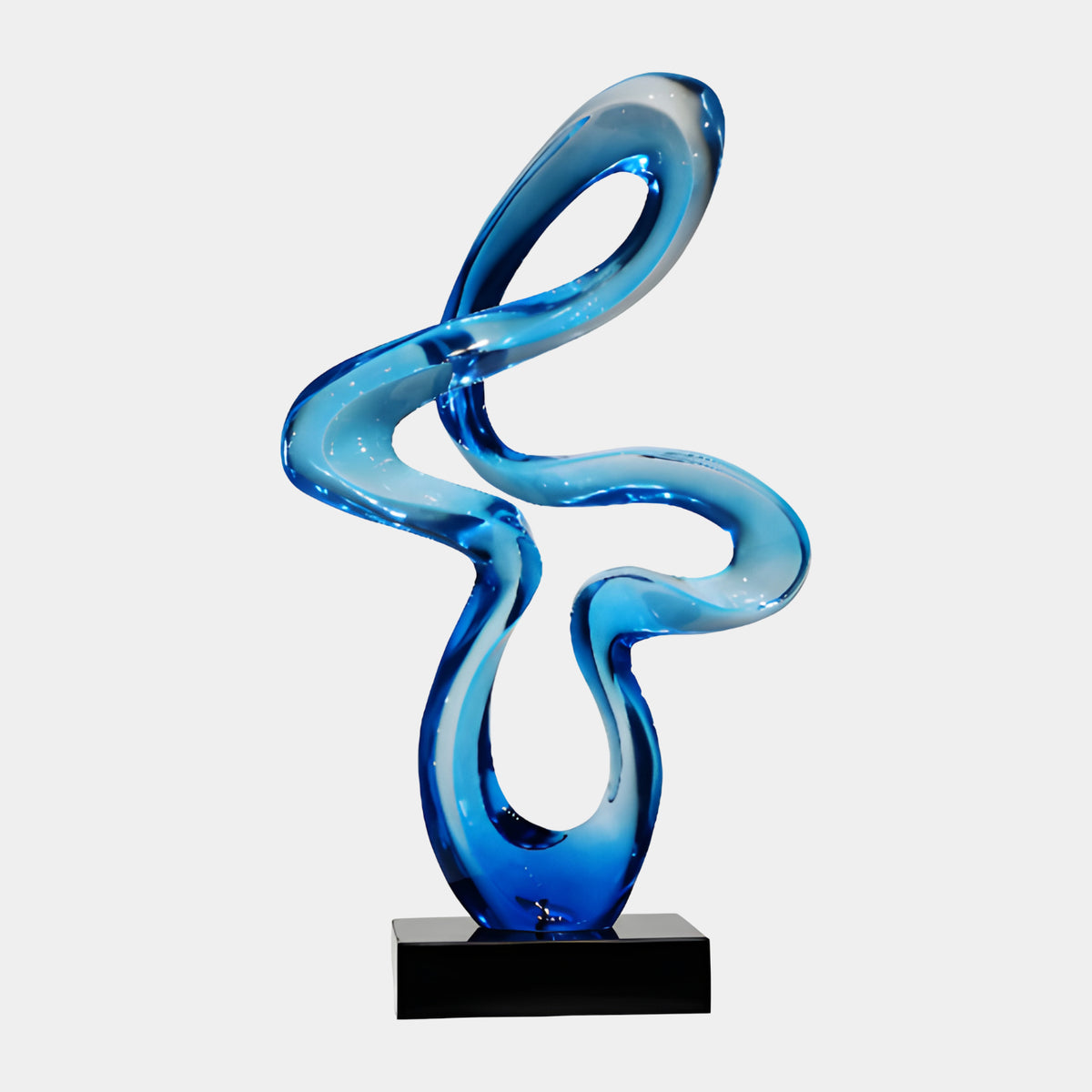 Blue Open Looped Ribbon Knot Resin Sculpture, 73cm, swirling looped ribbon form in shades of blue on a black marble base, set against a plain white background.