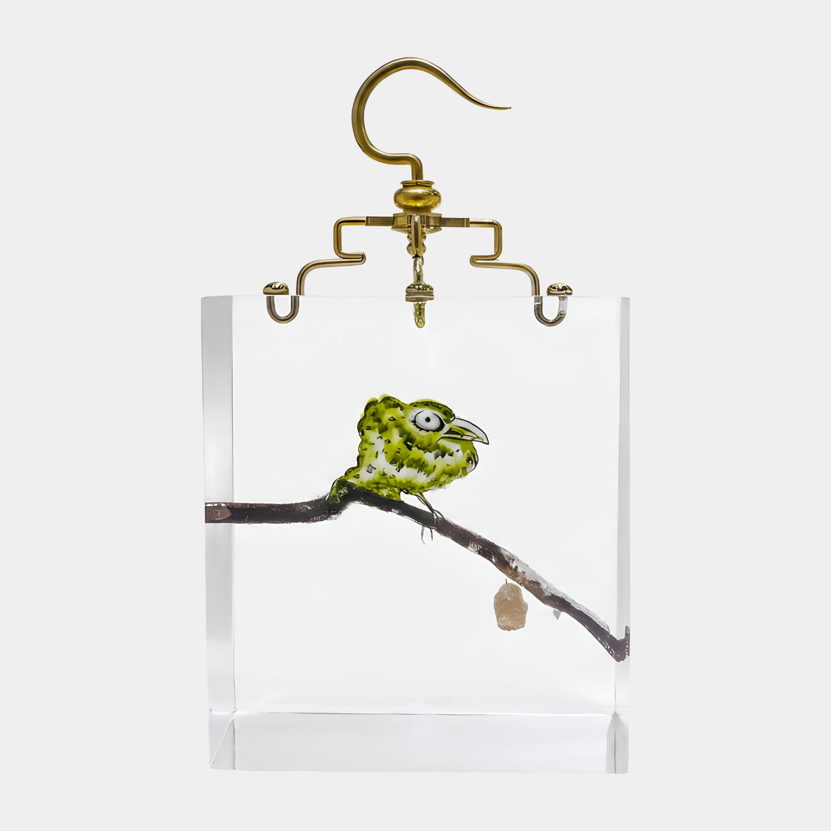 Green Bird in Clear Resin Hanging Sculpture - 37cm, showing a green and yellow bird on a branch inside a clear resin block with a gold hanging fitting, on a white background.