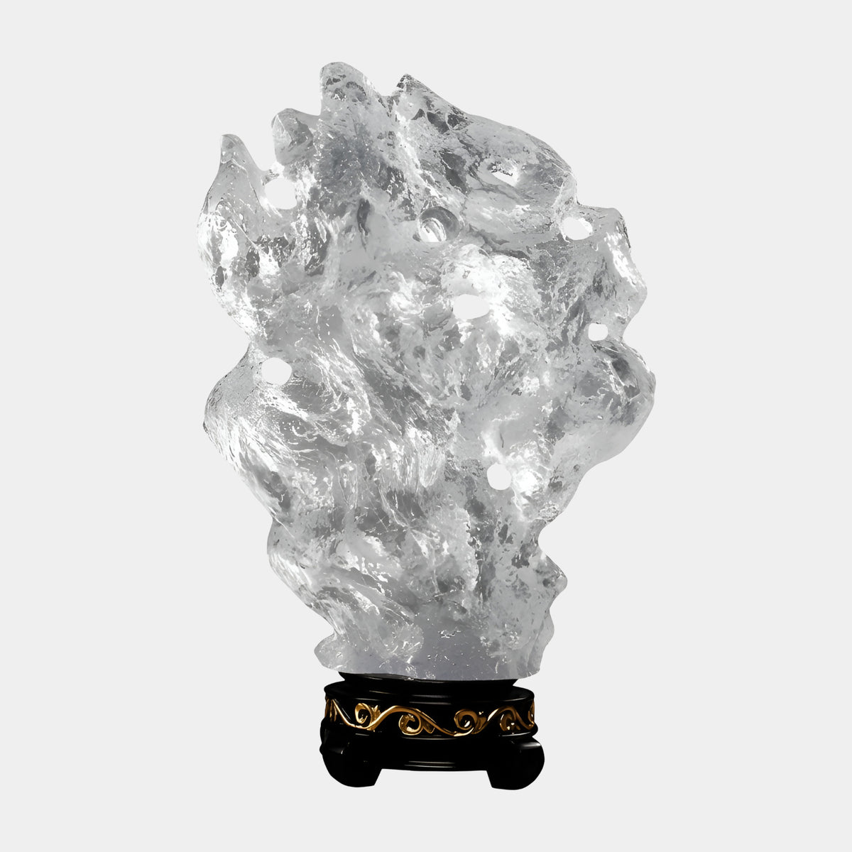 Clear Pierced Rock Resin Sculpture, 67cm, by Giant Sculptures, a clear textured rock-like form with scattered openings on a black and gold banded foot, against a plain white background.