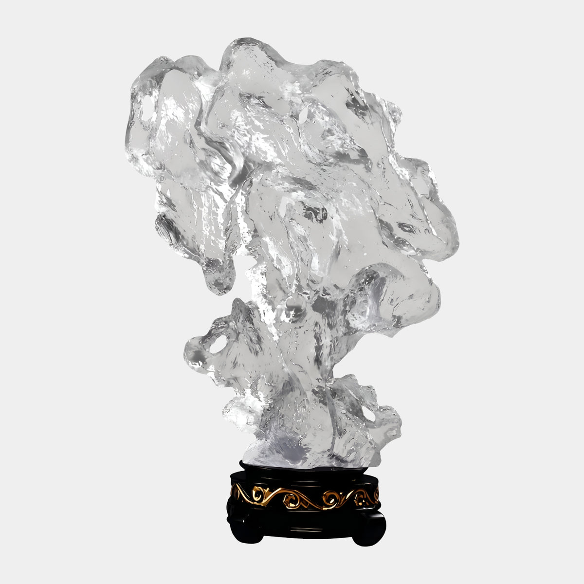 Clear Riddled Rock Resin Sculpture (67cm) with coarse, porous form on a black stand with gold scrollwork, shown against a plain white background.