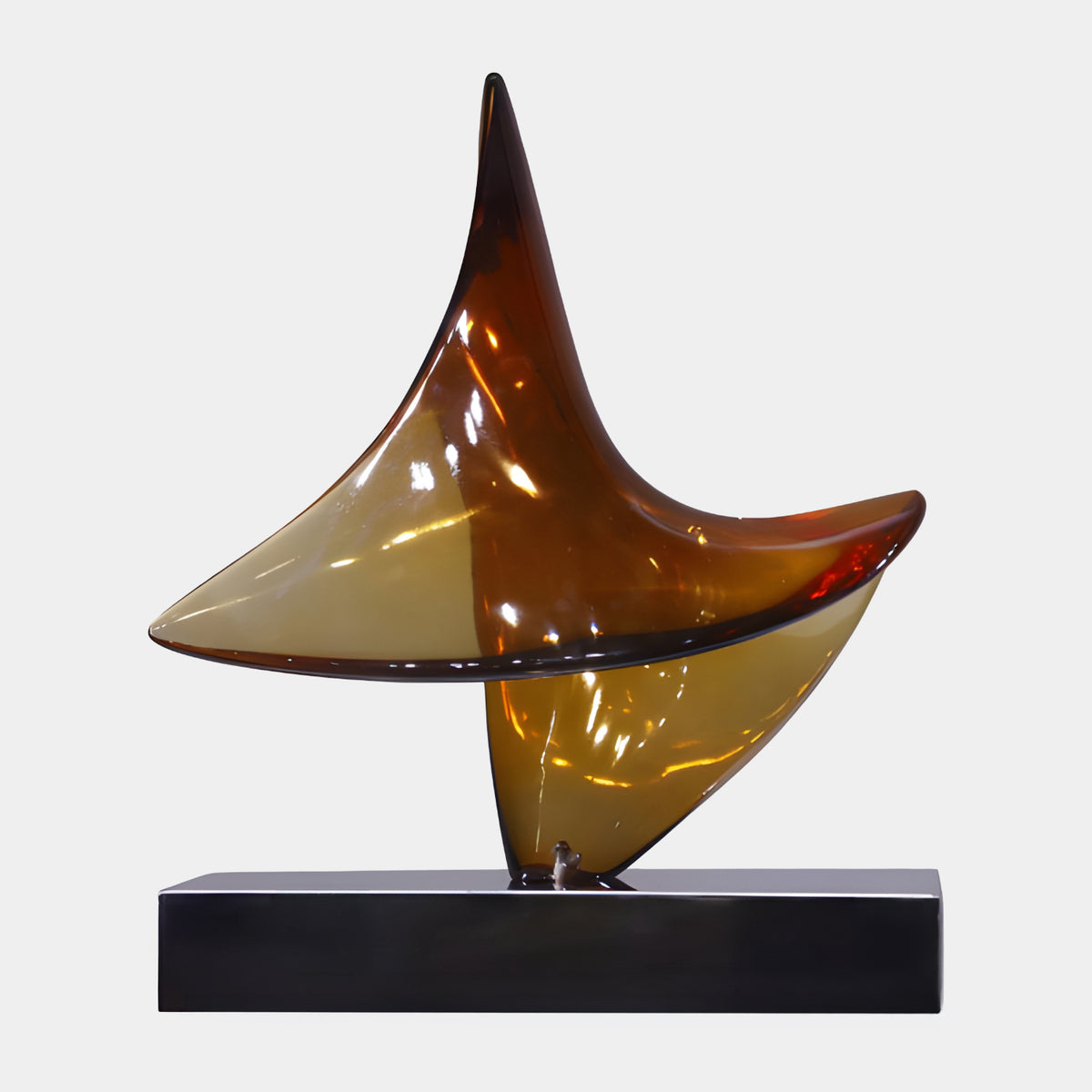 Amber Curved Sheet Resin Sculpture - 59cm, a glossy curved resin form with pointed peaks in amber and pale tones, set on a mirrored black steel base against a plain white background.
