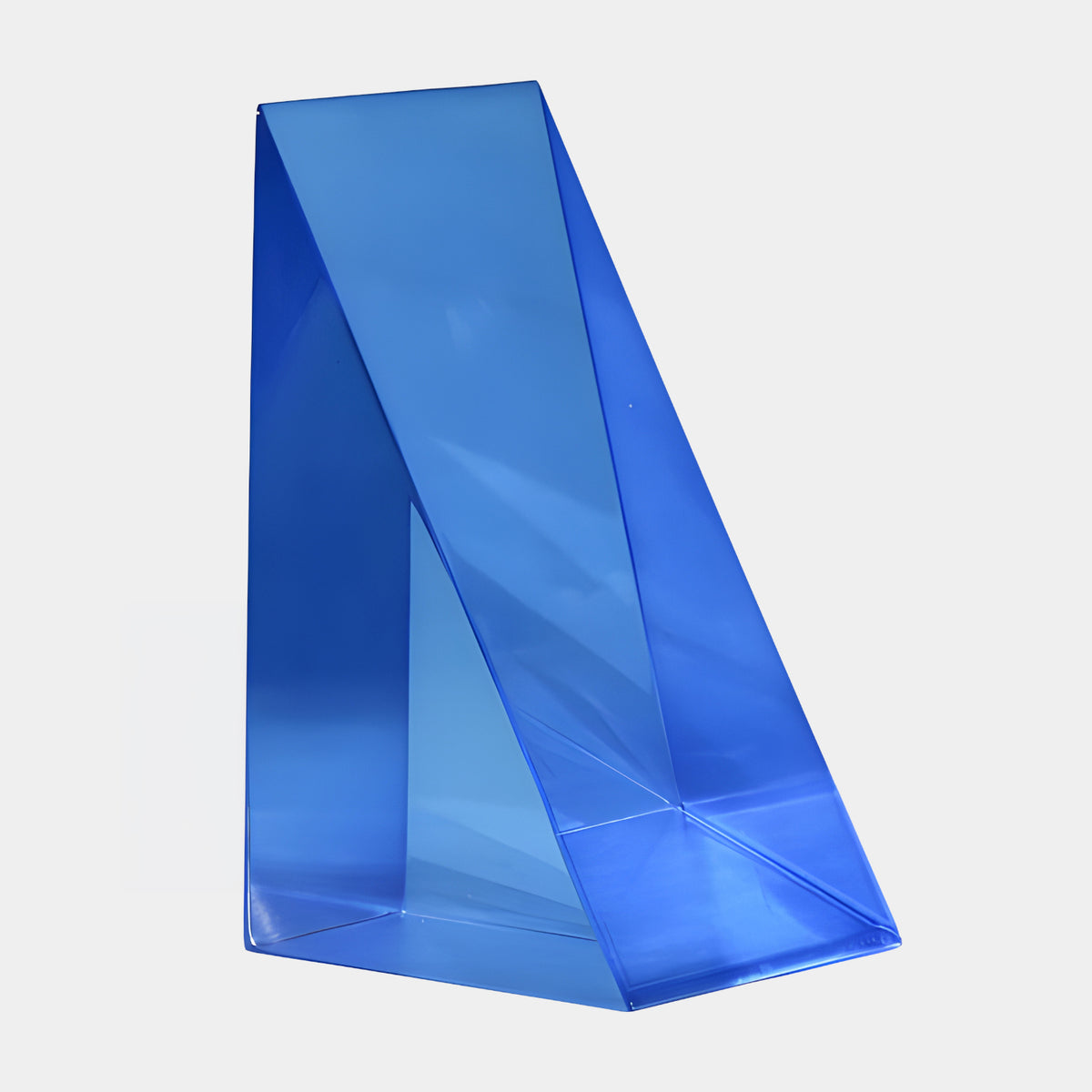 Blue Cut Faceted Wedge Resin Sculpture, 18cm, with a diagonal sloped face, shown on a plain white background with no base.