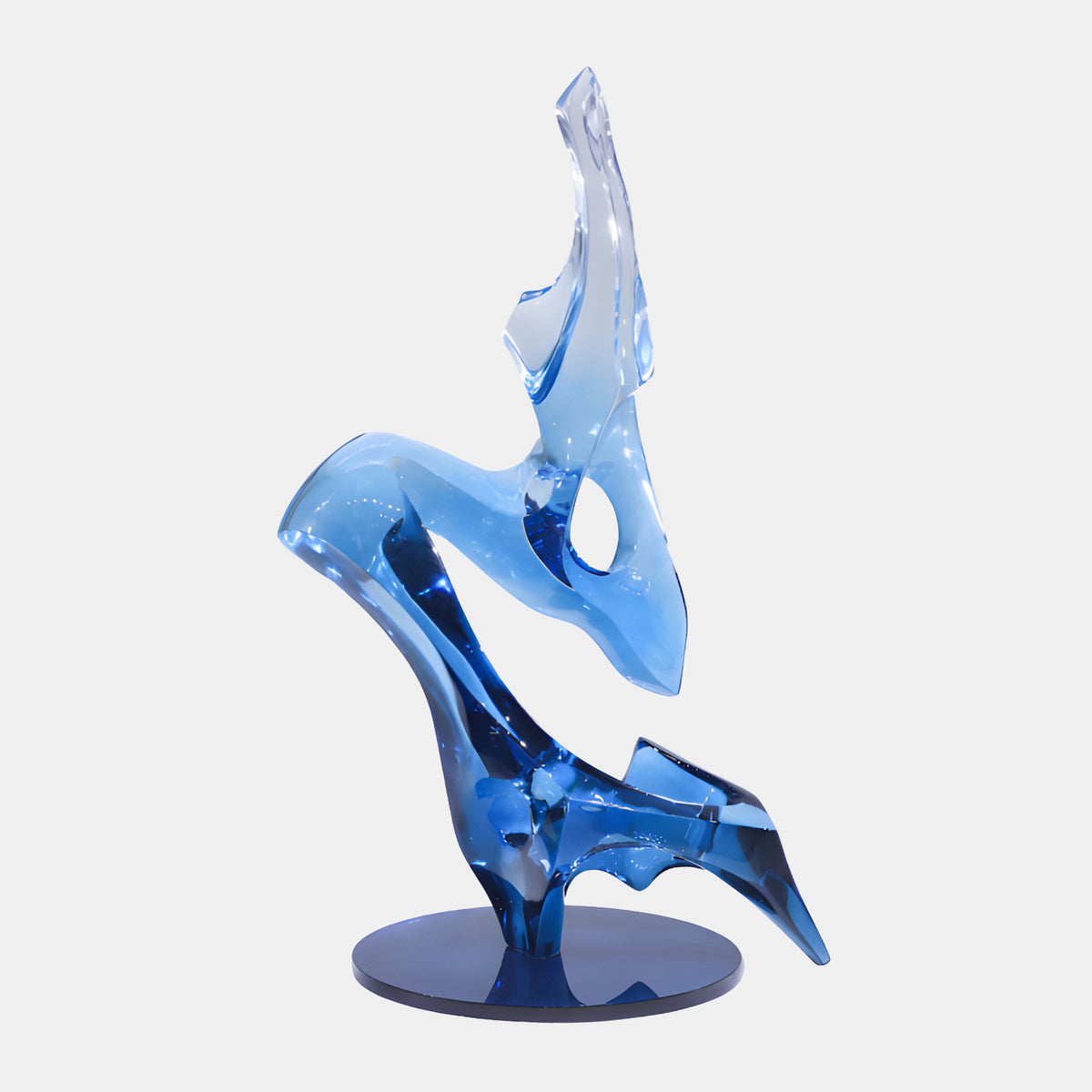 Deep Blue Pierced Folded Form Resin Sculpture, 120cm, polished resin piece rising from a spread foot and folding with a pierced opening, deep blue fading to clear, on a round dark base against a plain white background.