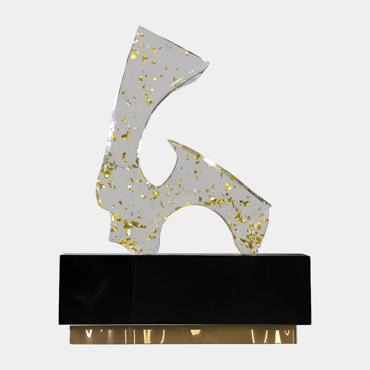 Clear & Gold Cut Plate Resin Sculpture - 69cm, an abstract angular form with gold leaf flecks, set on a black marble block over a gilt base, shown against a plain white background.