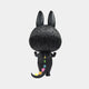 The Monster Zimomo Titan Labubu Sculpture (70cm) by Giant Sculptures features a black, furry figure with large upright ears and a tail adorned in vibrant yellow, pink, green, and blue geometric patterns—perfect for playful modern decor.