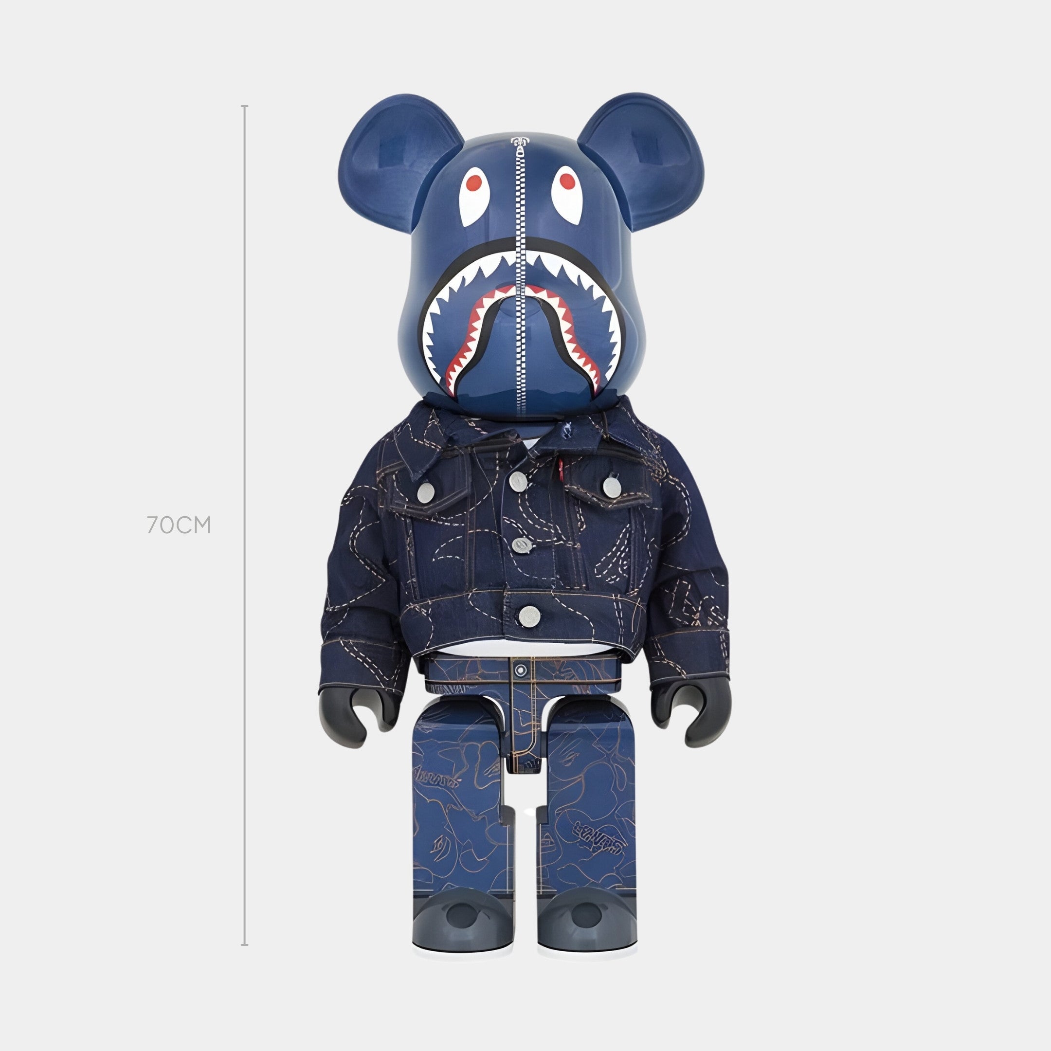 The Zipper Jaw Bear Sculpture - 70cm by Giant Sculptures features a blue shark face, detailed denim jacket and pants, and streetwear-inspired design. This limited edition collectible stands out against a plain light background.