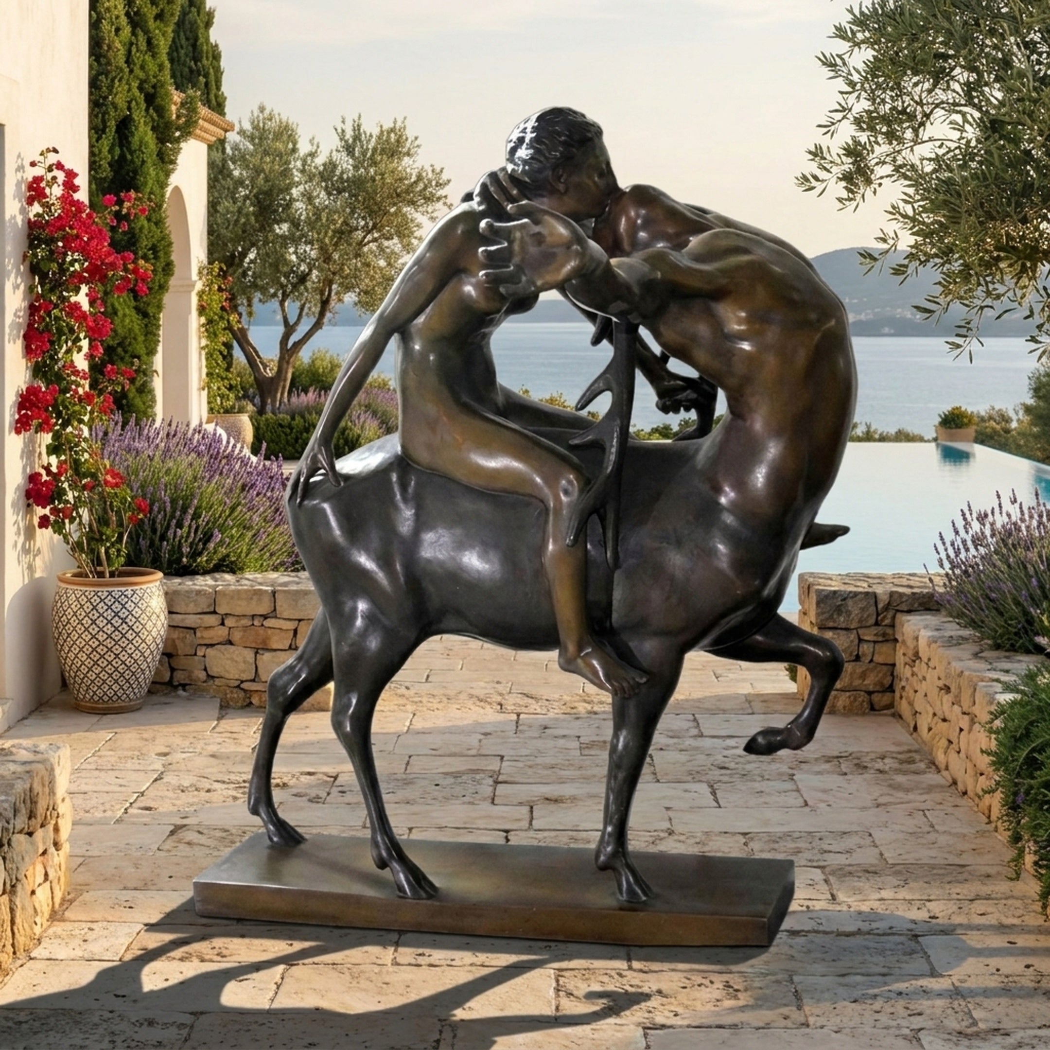 Classical Centaur and Nude Female Figure Bronze Sculpture by Giant Sculptures, dark patina, shown on a seaside terrace with lavender and olive trees.