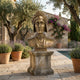 Classical Dante Alighieri Bronze Bust 60cm by Giant Sculptures on a weathered stone plinth in a Mediterranean courtyard with olive trees, lavender, and a pool.