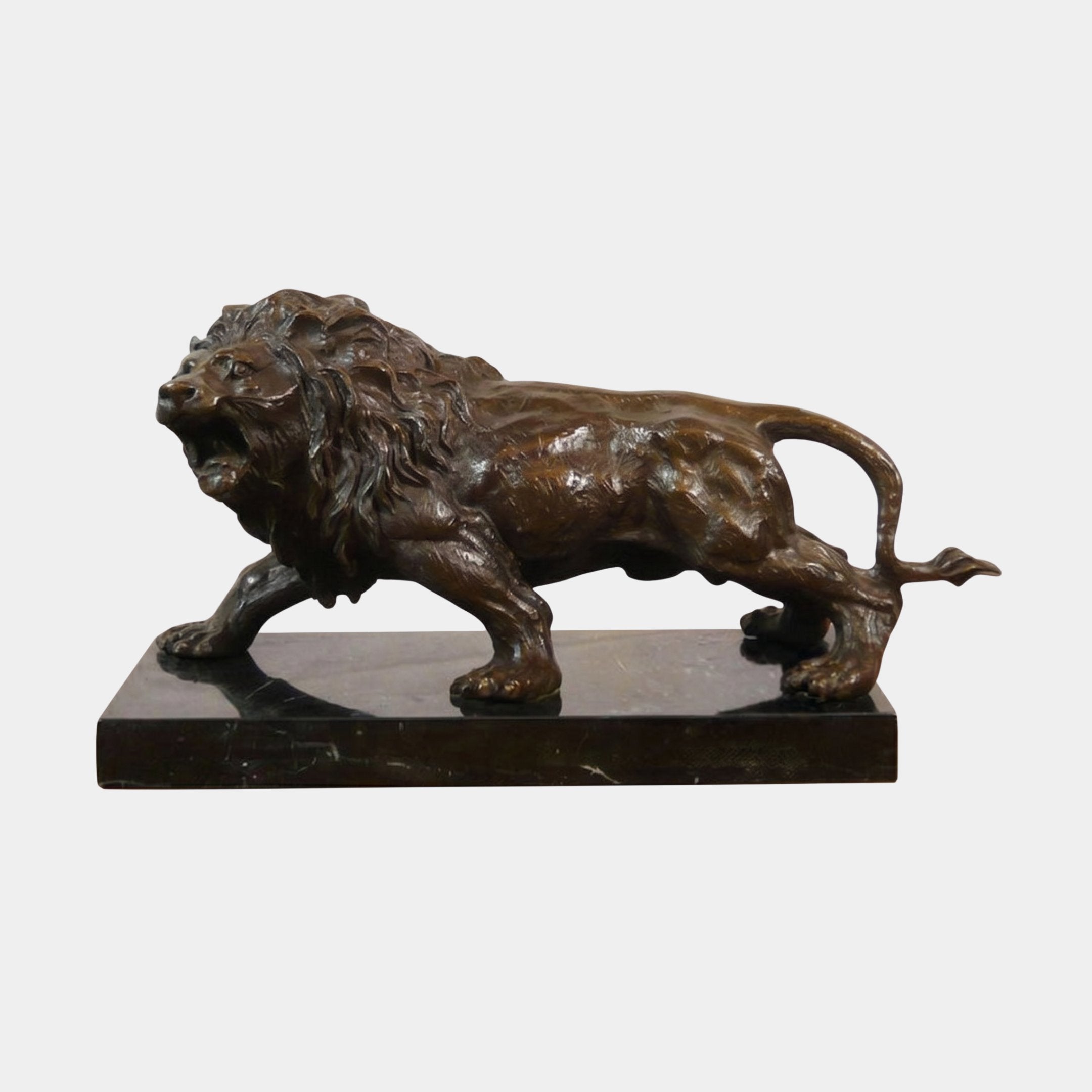 Giant Sculptures Classical Prowling Lion Bronze Sculpture in dark brown patina, shown side-on mid-stalk with open roar, on a black marble plinth.