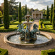Giant Sculptures Classical Rearing Horses and Tiered Fountain Bronze Sculpture 250cm with verdigris horses around a stone tiered fountain in a formal topiary garden.