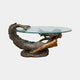Classical Reclining Mermaid Bronze Table Sculpture by Giant Sculptures, with antiqued tail arched up to support an oval glass top, on a plain background.