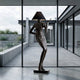 Contemporary Abstract Female Figure Bronze Sculpture 210cm by Giant Sculptures, dark patina figure with conical lampshade head, displayed in a concrete courtyard.