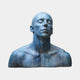 Contemporary Contemplative Male Bust by Giant Sculptures, 70cm bronze with blue-green patina, head tilted up and eyes closed, shown against a plain background.