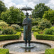 Contemporary Gentleman with Umbrella Bronze Fountain by Giant Sculptures, 220cm verdigris figure in coat and top hat with water cascading from the umbrella into a circular garden pool.